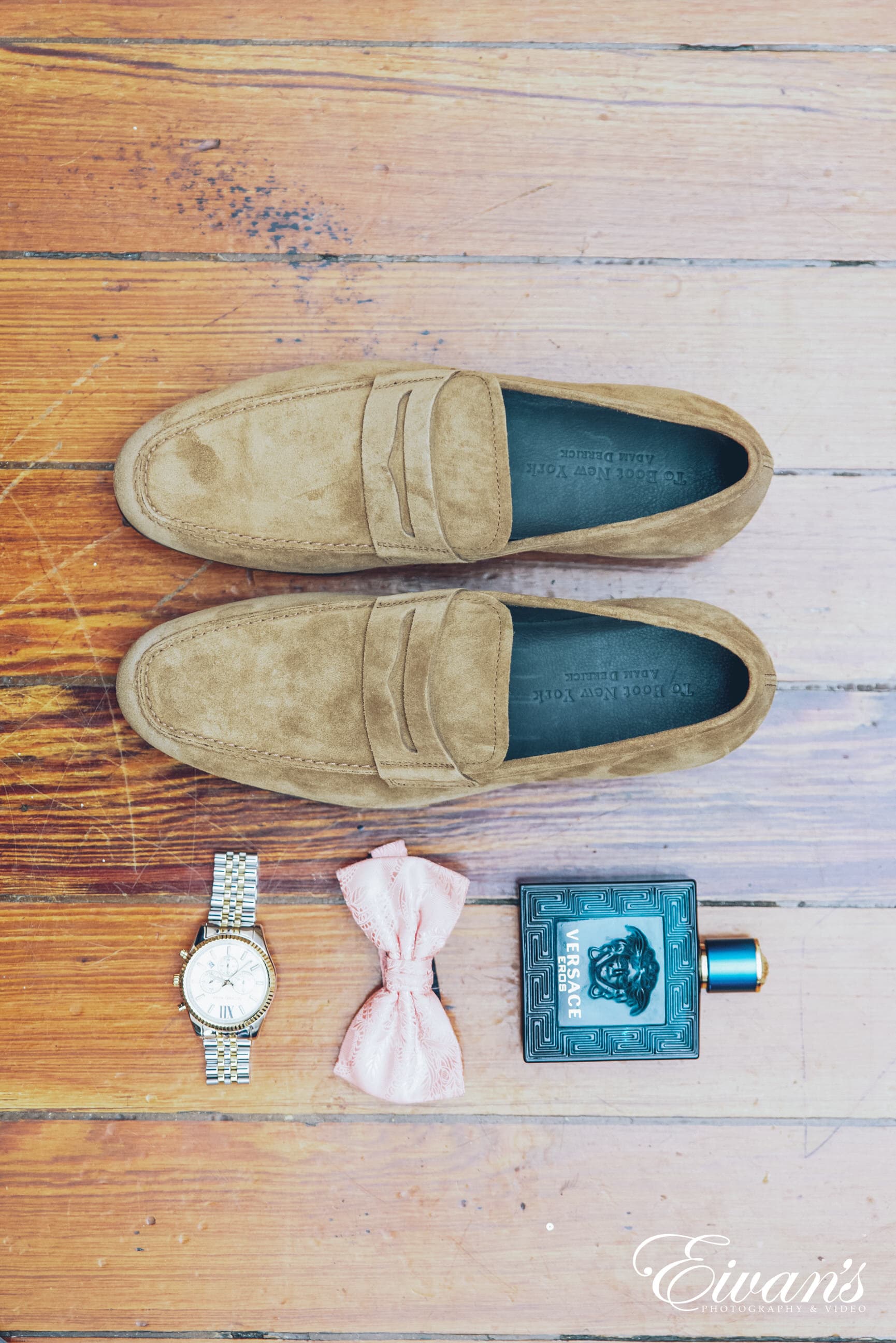 brown leather slip on shoes beside black and orange disposable lighter