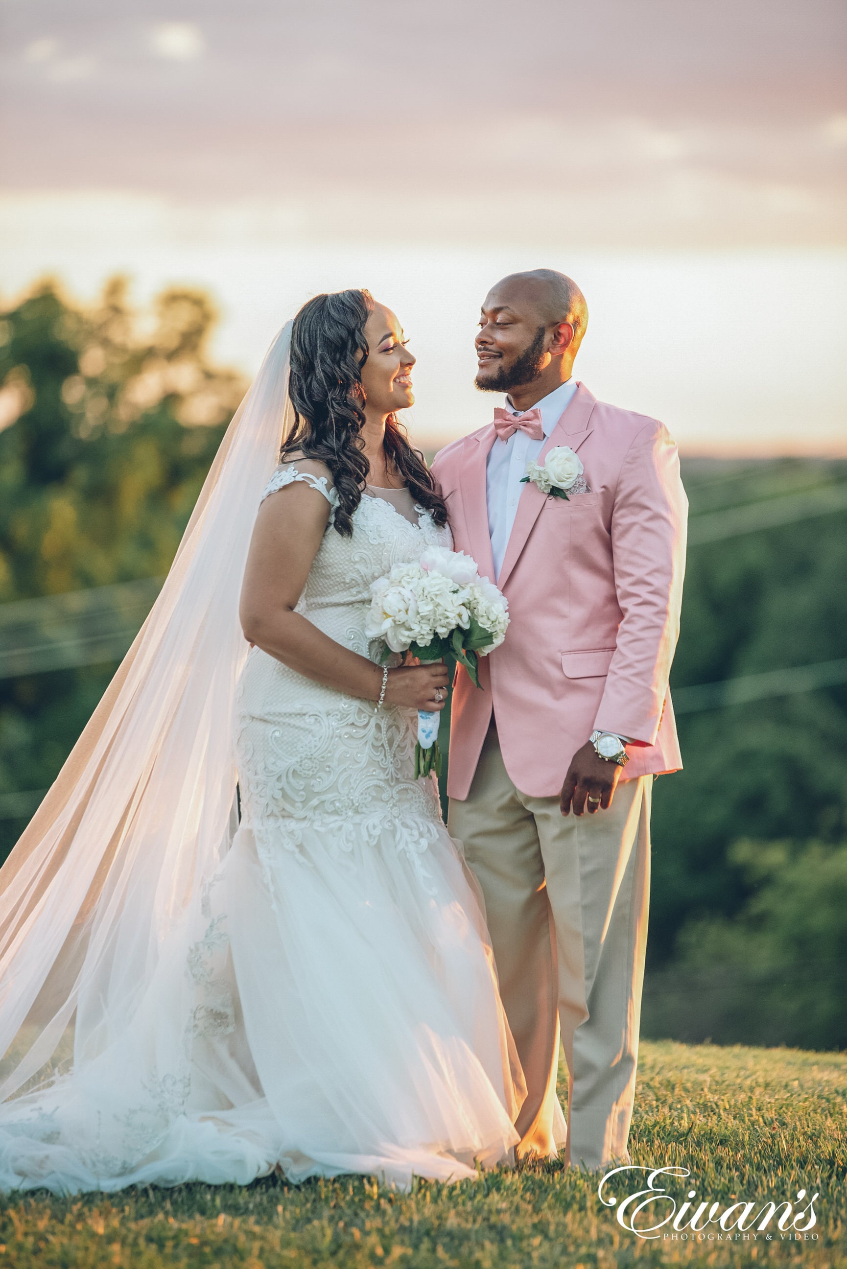 man in brown suit and woman in white wedding dress