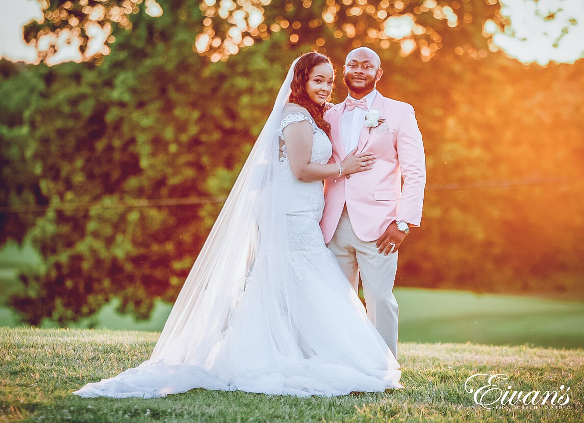 man in white suit and woman in white wedding dress