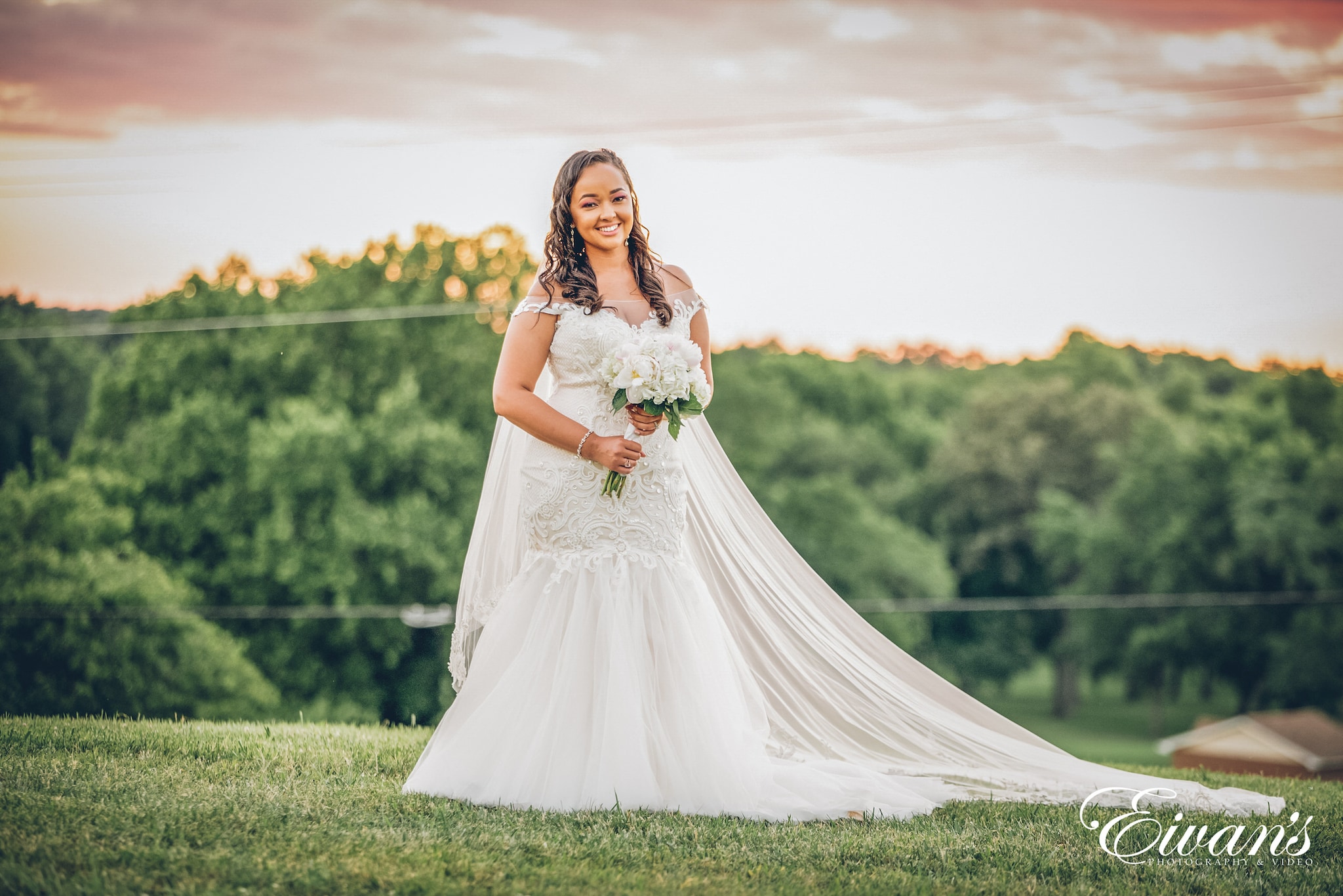 woman in white dress holding bouquet of flowers