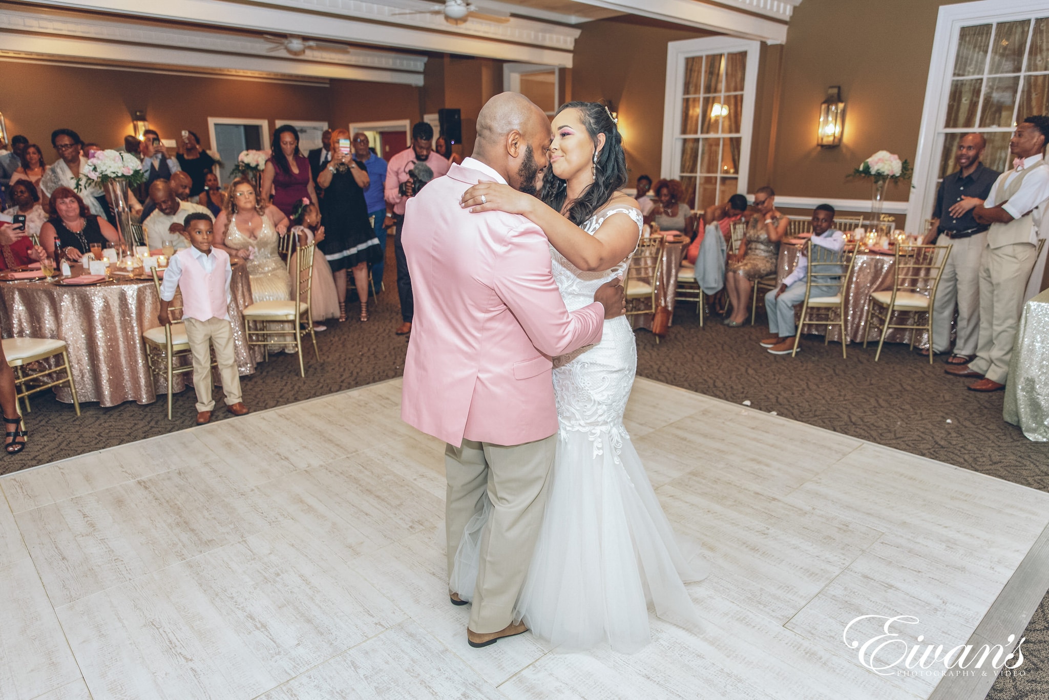 man and woman in white dress dancing