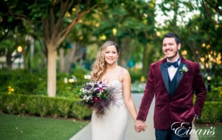 bride and groom wearing frost blush and boysenberry colors