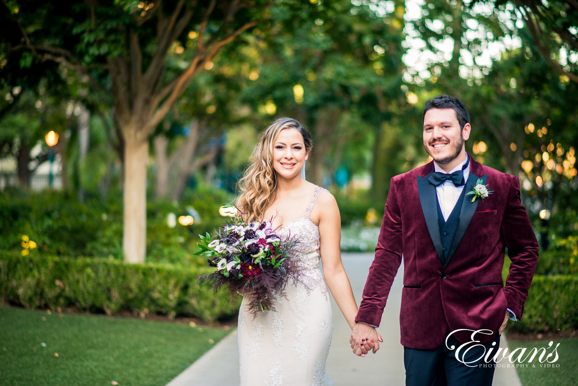 bride and groom wearing frost blush and boysenberry colors