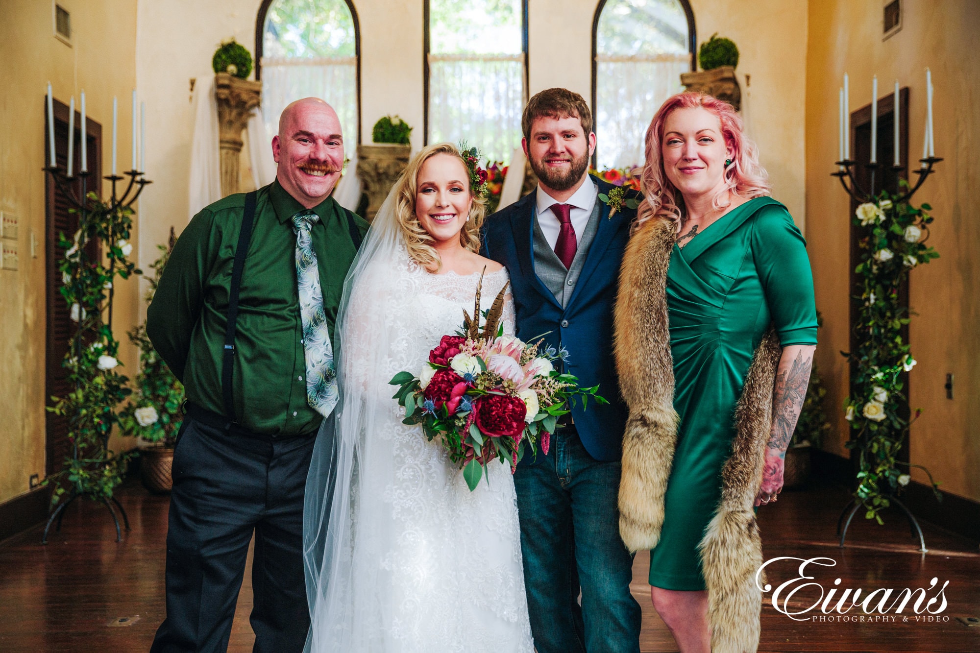 man in black suit jacket beside woman in white wedding dress