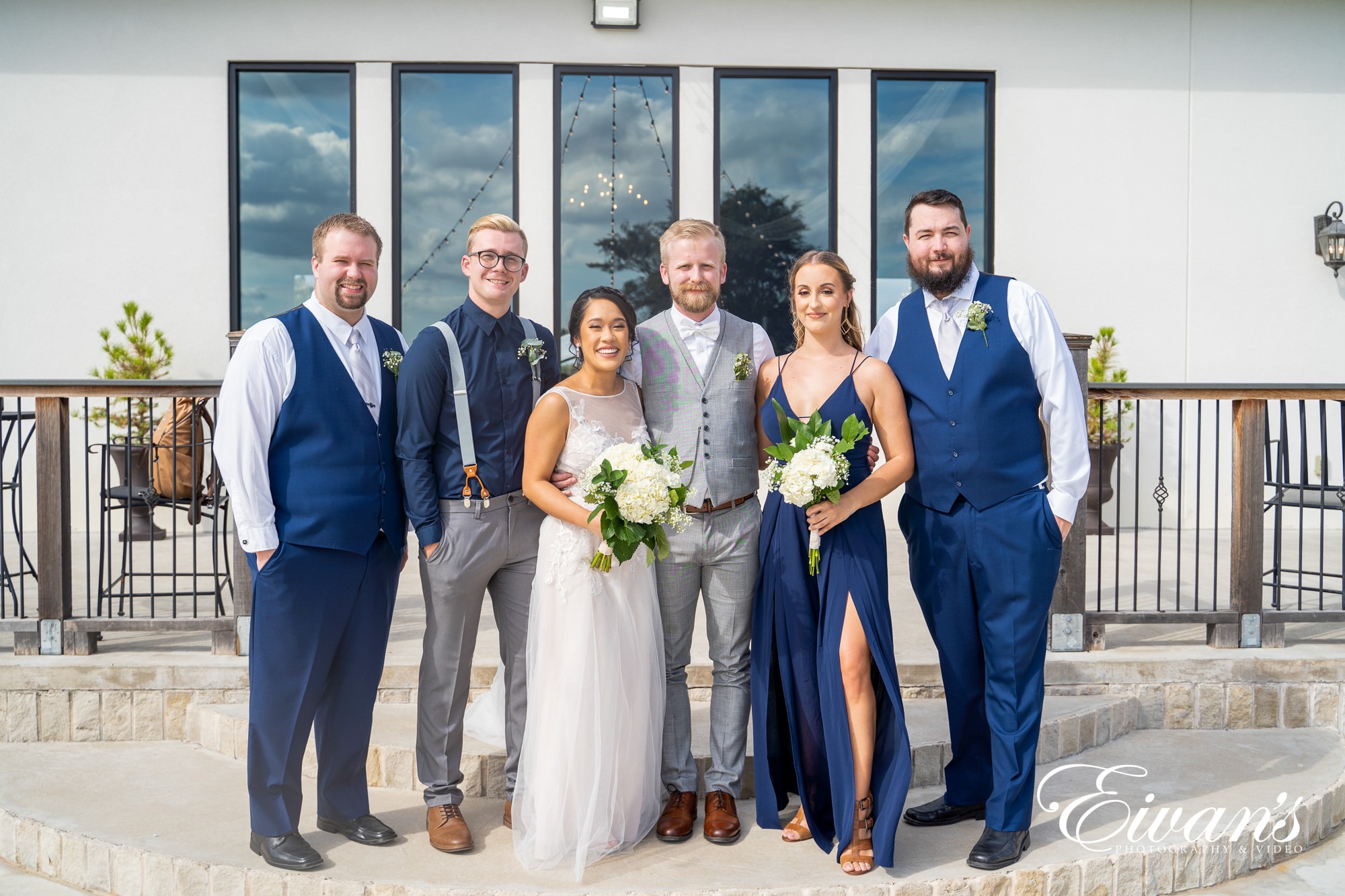 wedding party wearing grey and navy colors at wedding ceremony