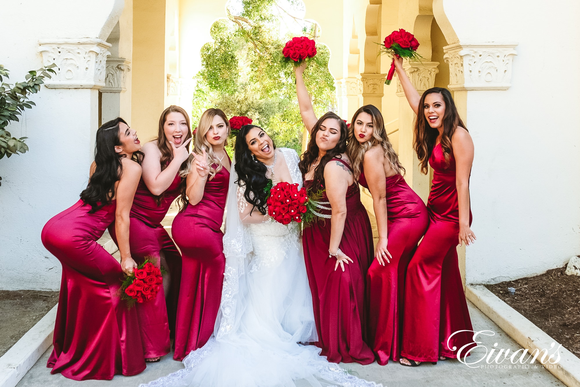 seven women in red dresses