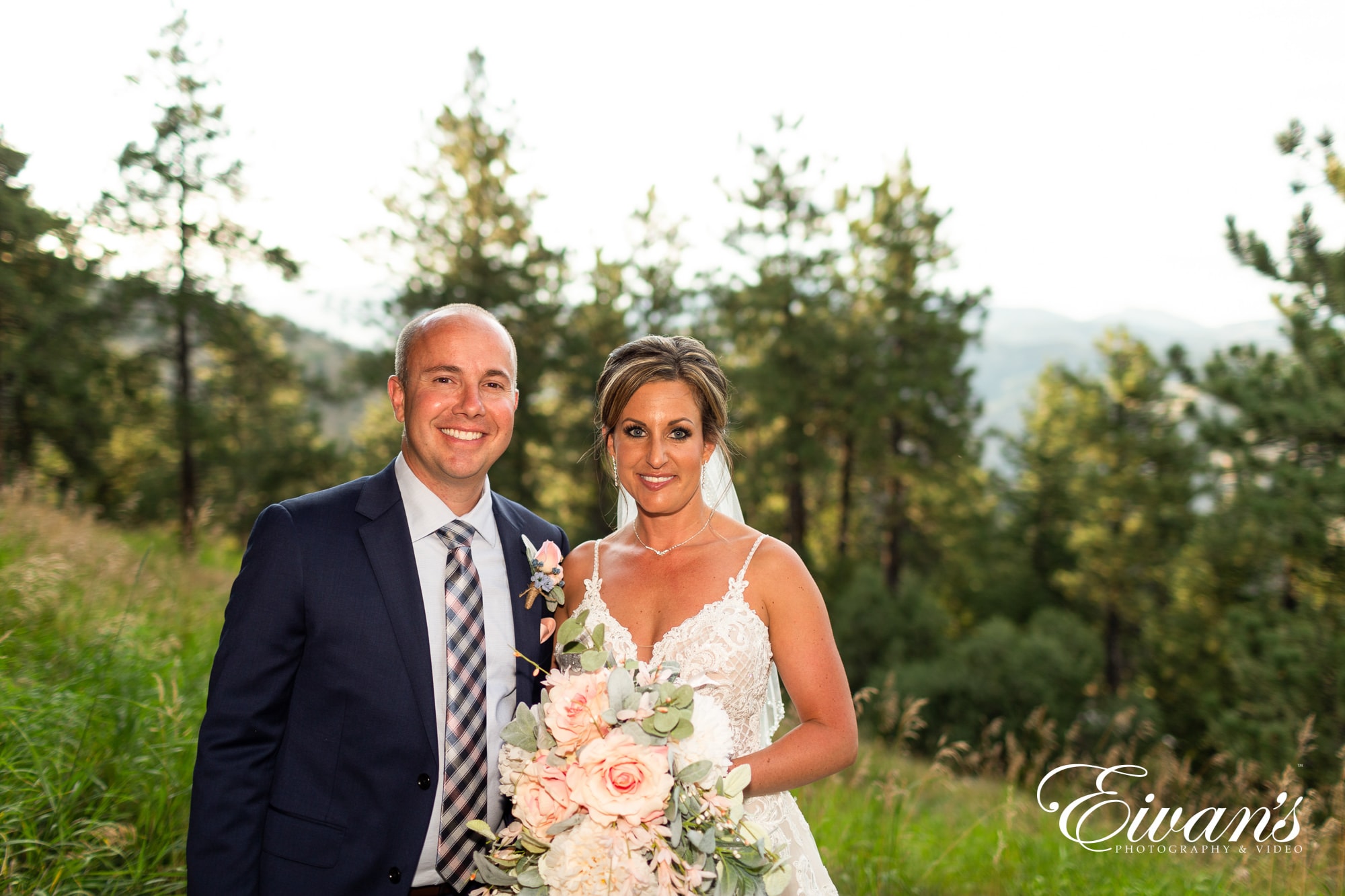 man in black suit and woman in white wedding dress