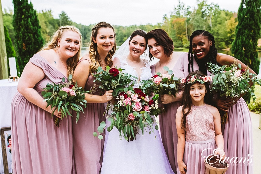 bridal party holding bouquet of flowers