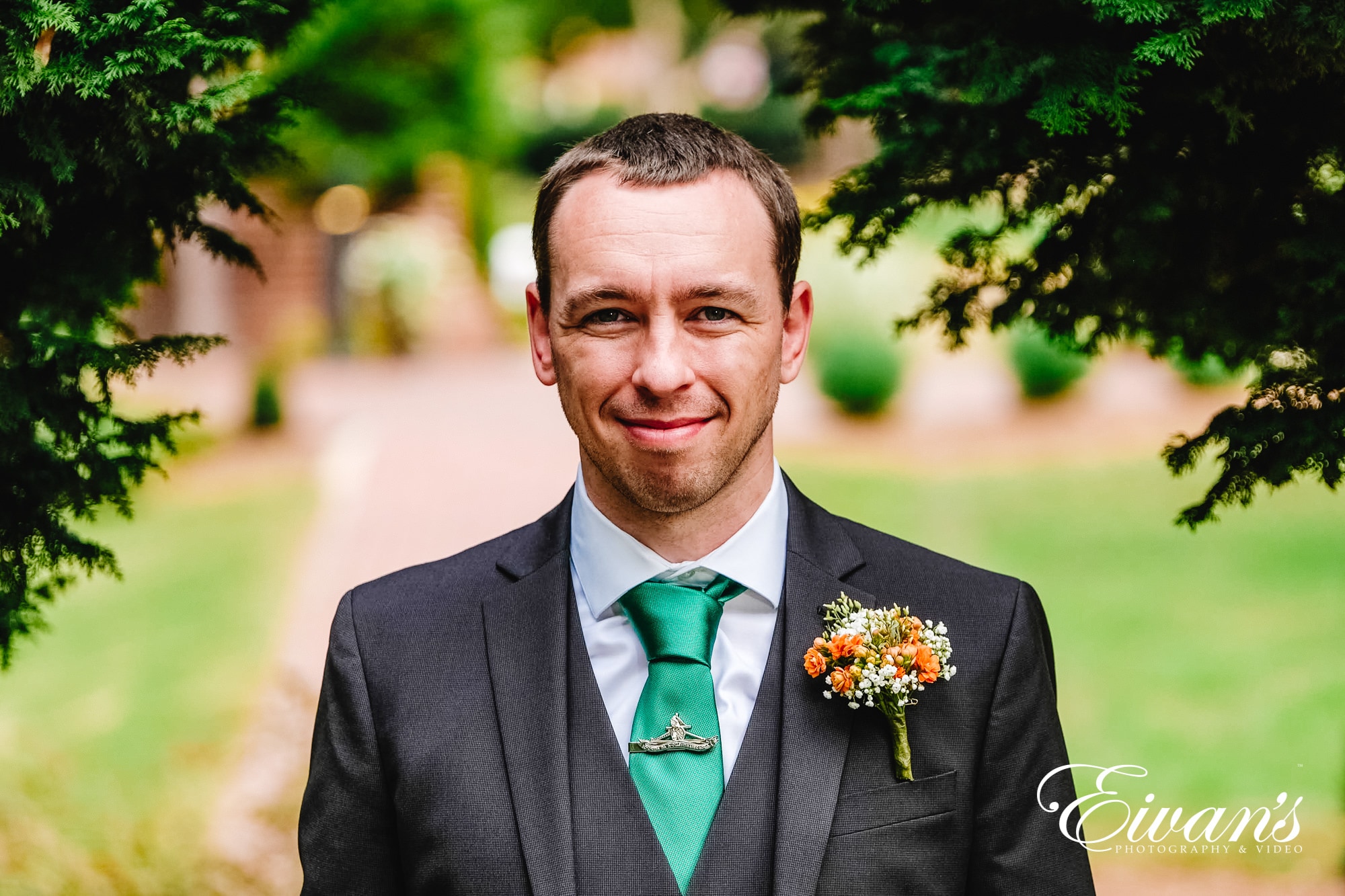 man in black suit jacket smiling