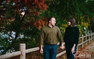 couple walk through a park