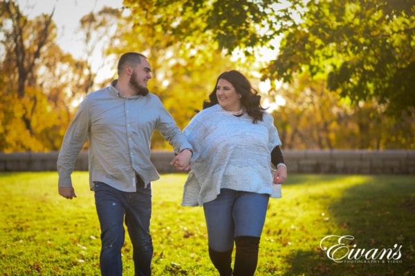 Engaged man and woman running