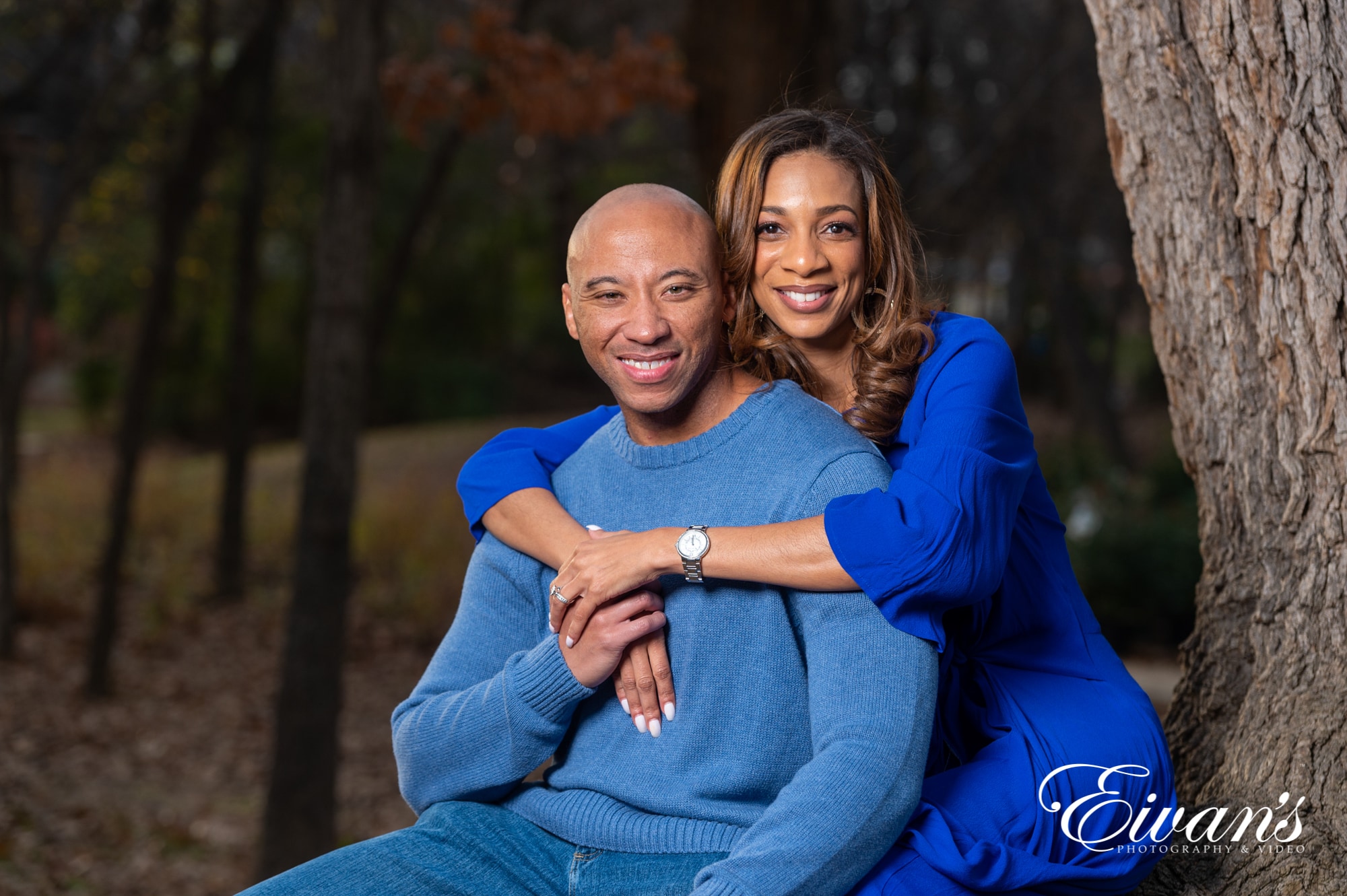 engaged man and woman wearing blue