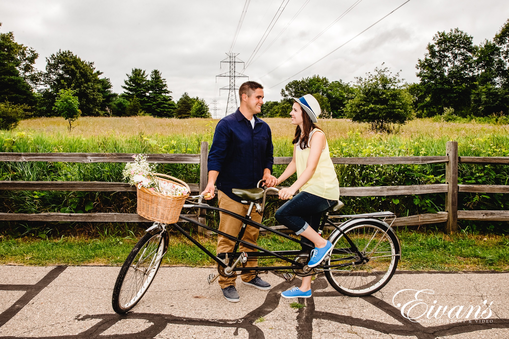 cute-engagement-photos Image of an engaged man and woman on a two person bike