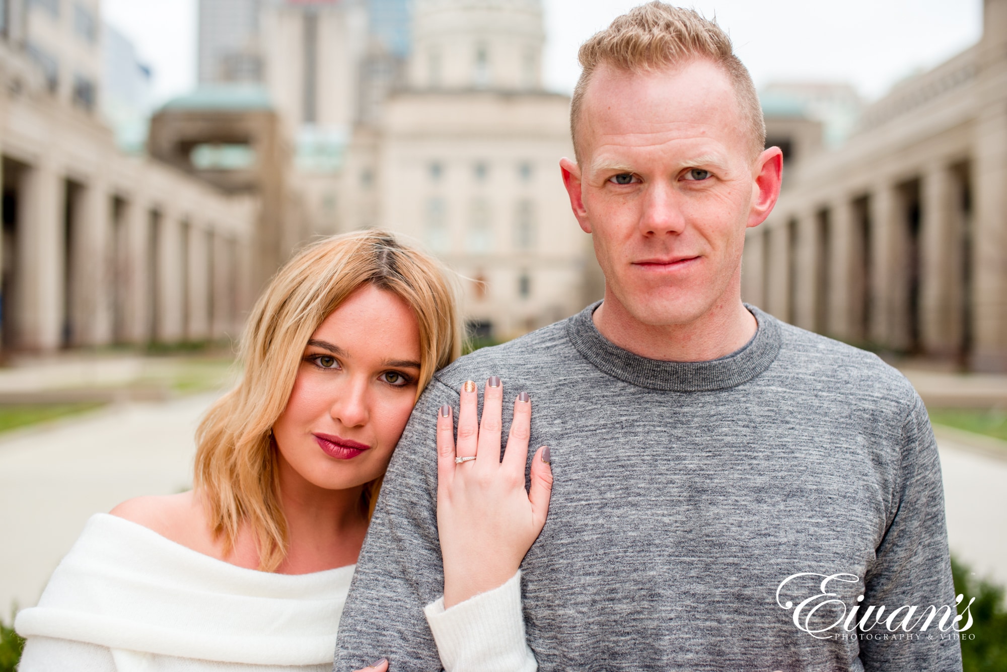 Engaged man and woman standing side by side