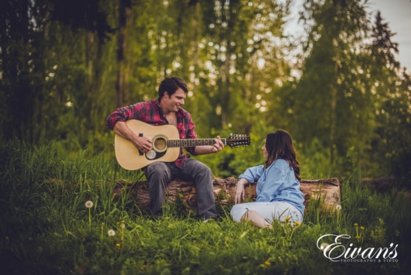 Engaged couple in the woods