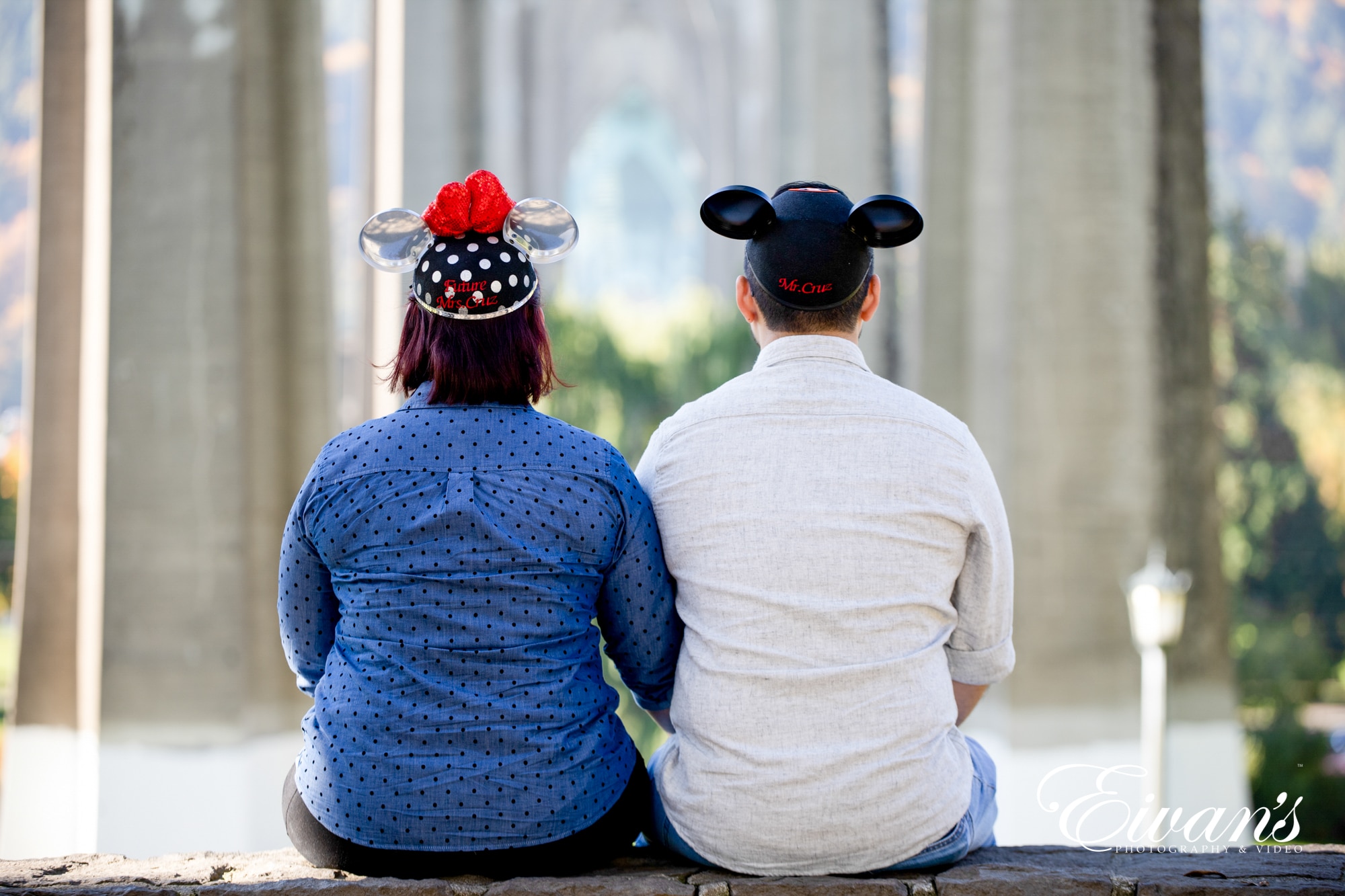 cute-engagement-photos Image of an engaged couple wearing Mickey Mouse hats