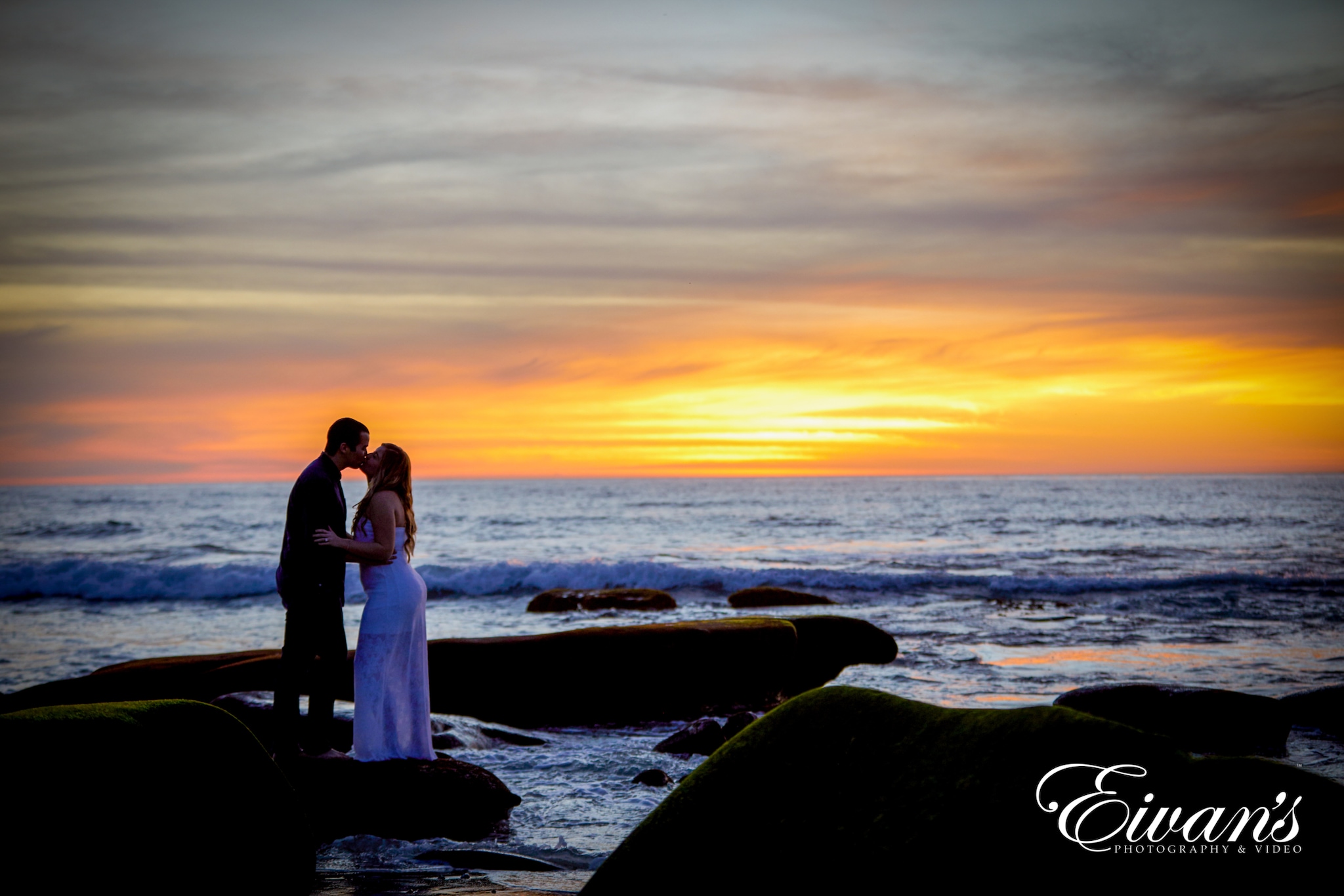 image of a man and woman near a sunset