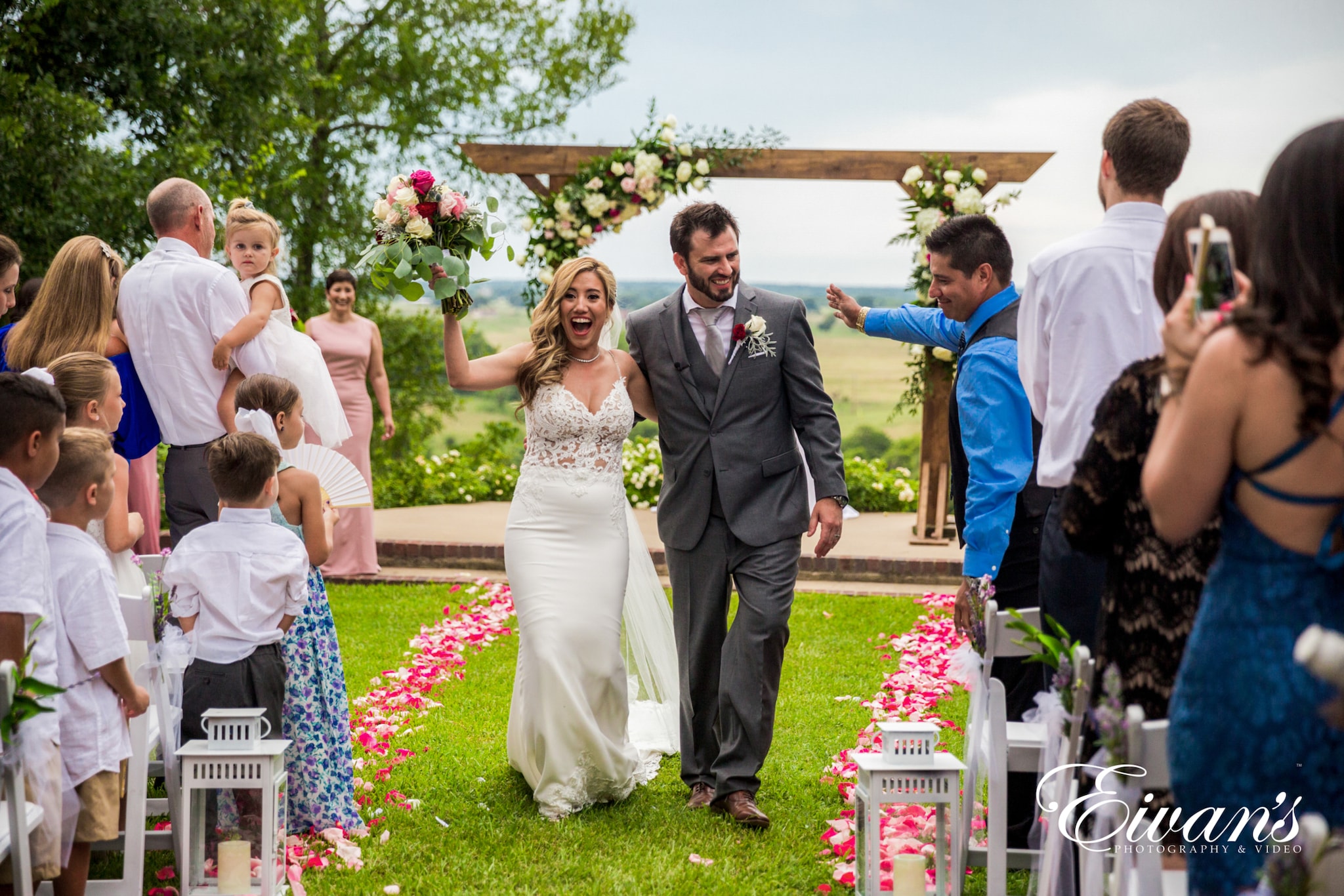 country-chic-wedding image of a married couple walking down the aisle