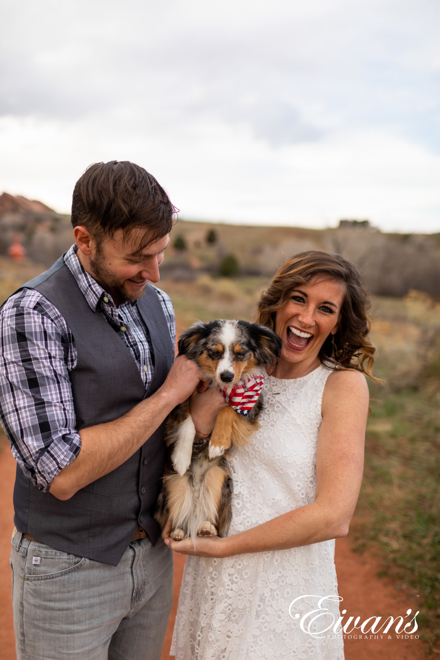 image of engaged couple with their dog