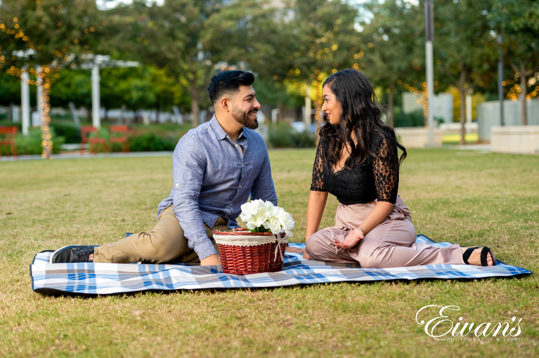 image of an engaged couple having a picnic