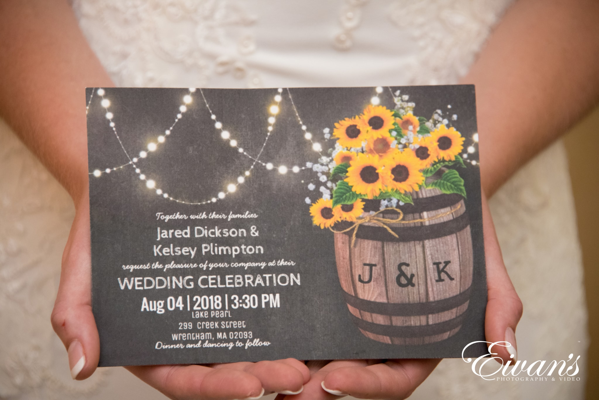 image of a bride holding a wedding invitation