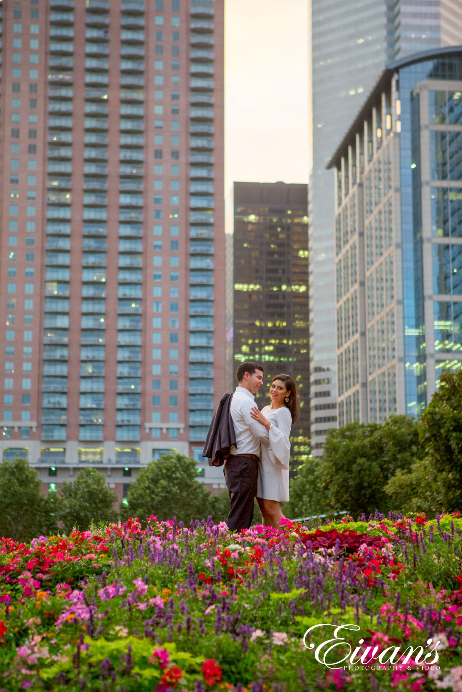 image of engaged couple in a meadow of flowers