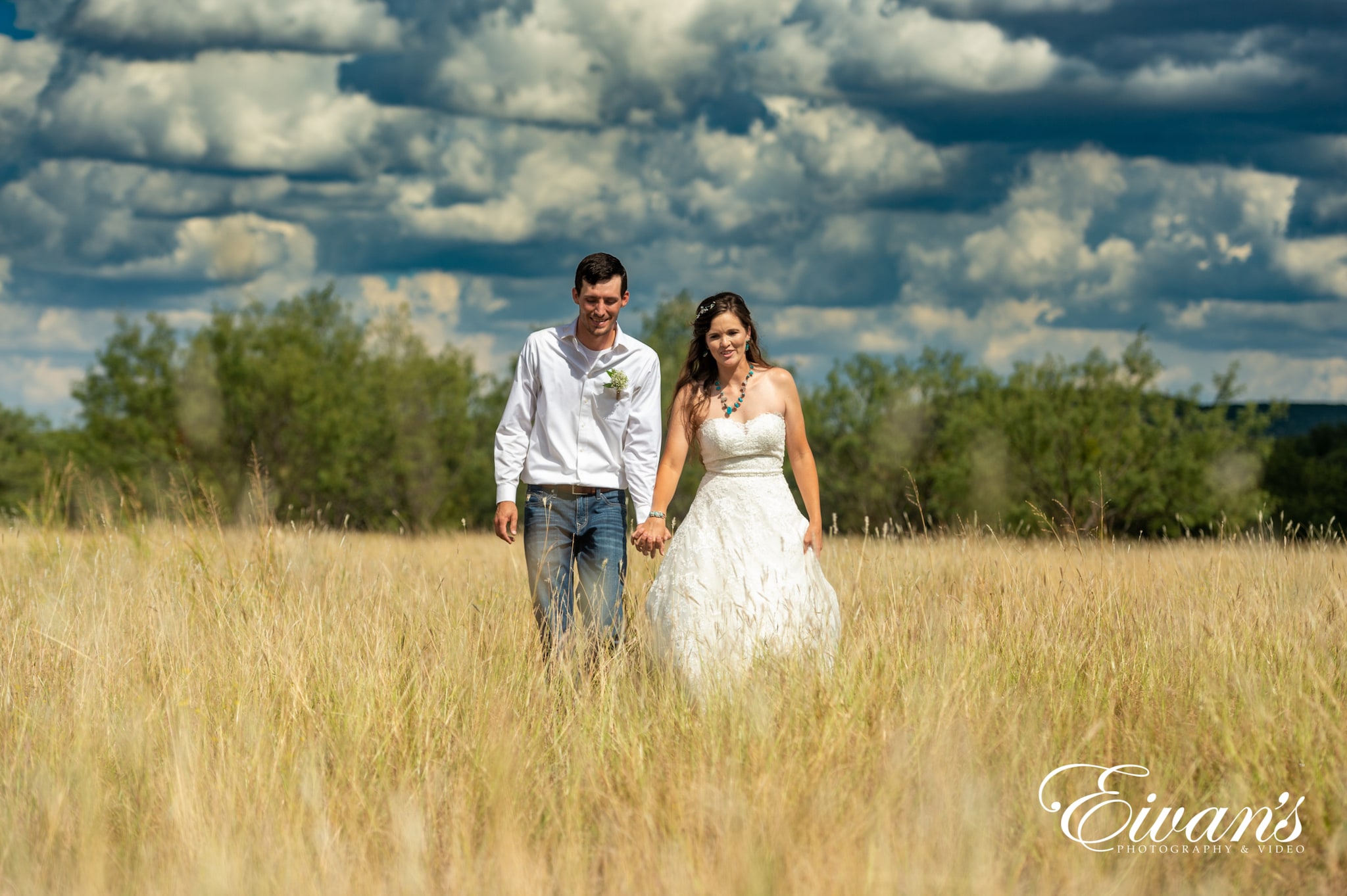 man and woman holding hands on brown grass field during daytime