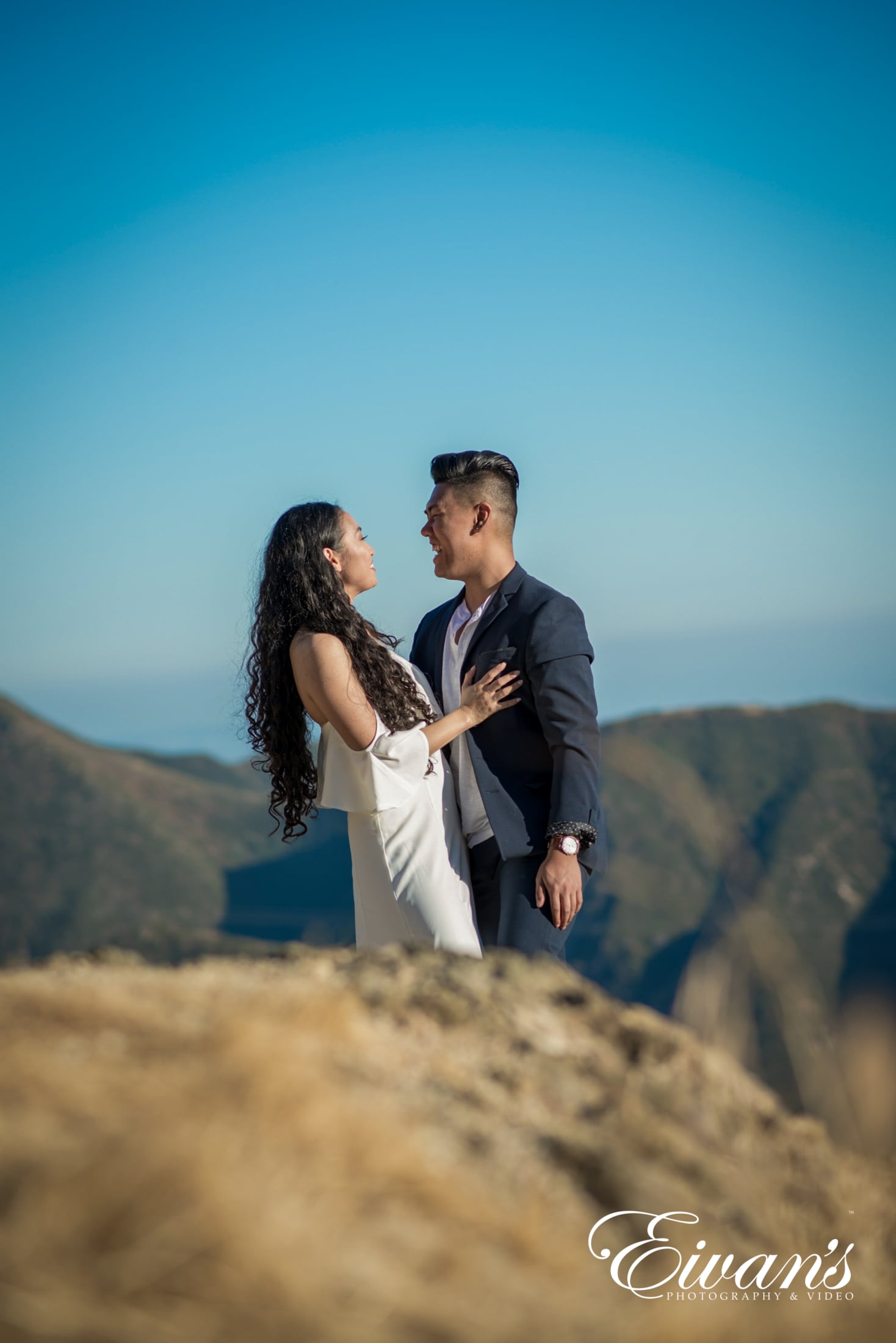 unique-engagement-photos image of a couple on the mountains