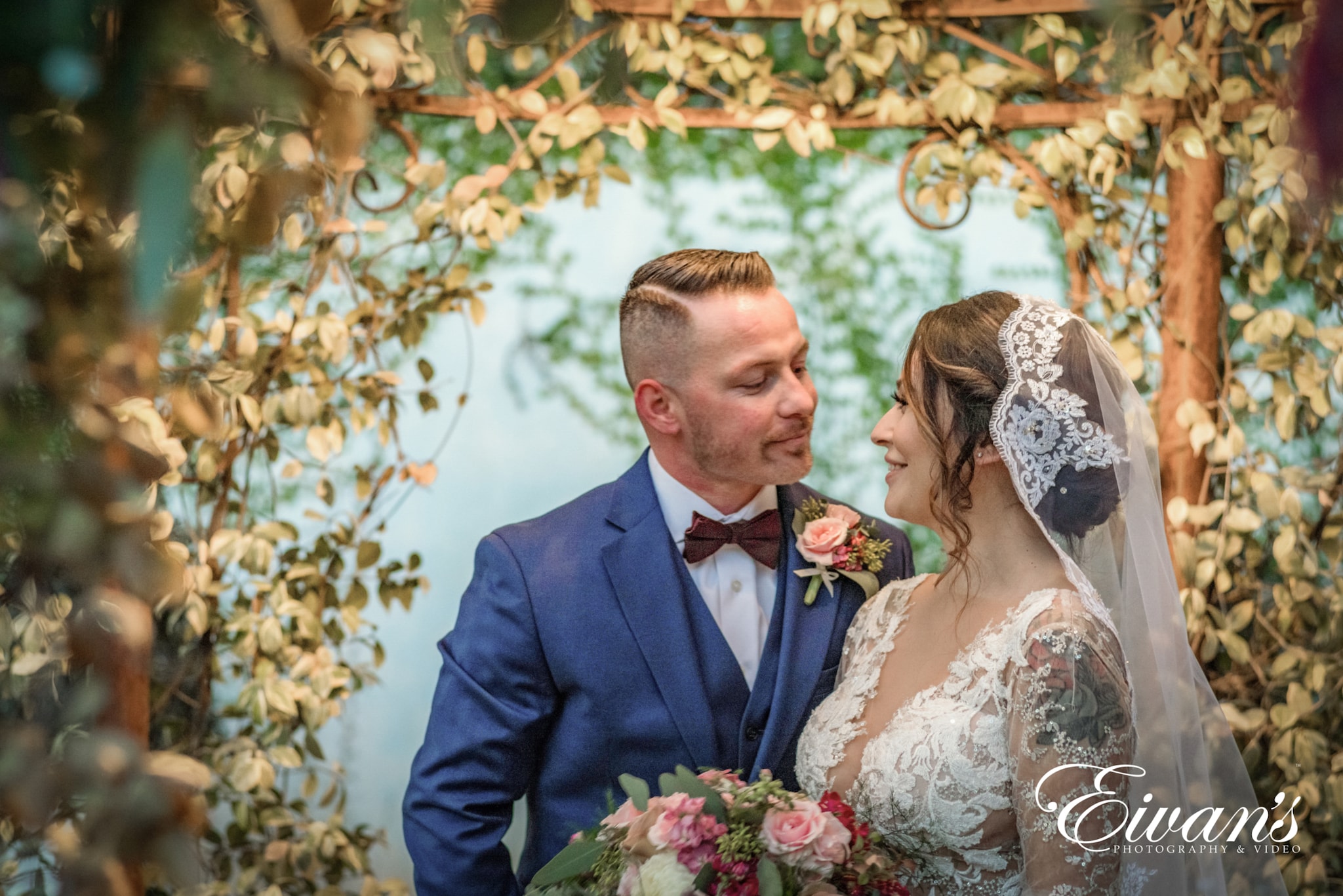 country-club-wedding image of a married couple in front of a blue wall