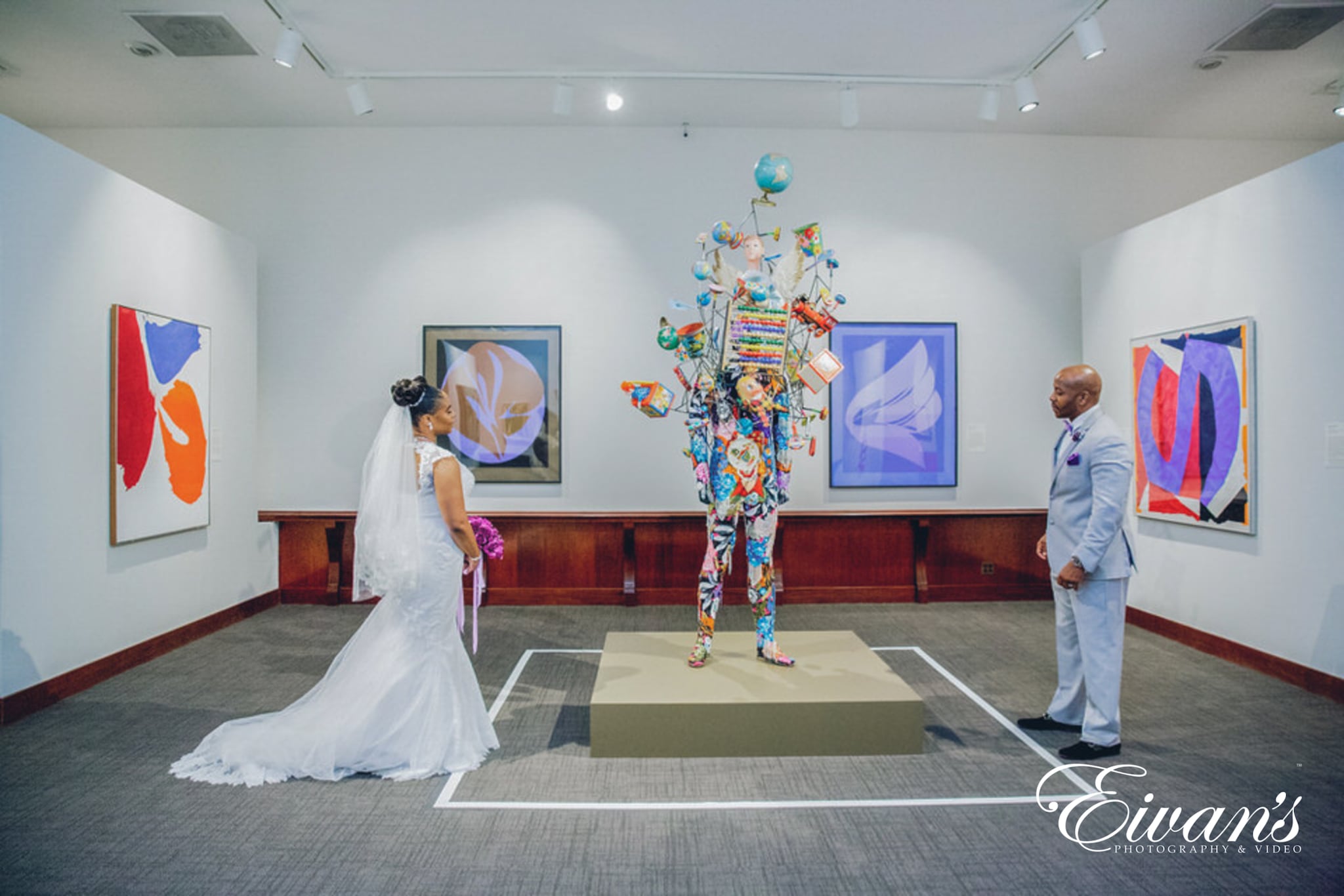 indoor-wedding-photos image of a married couple standing in an art gallery