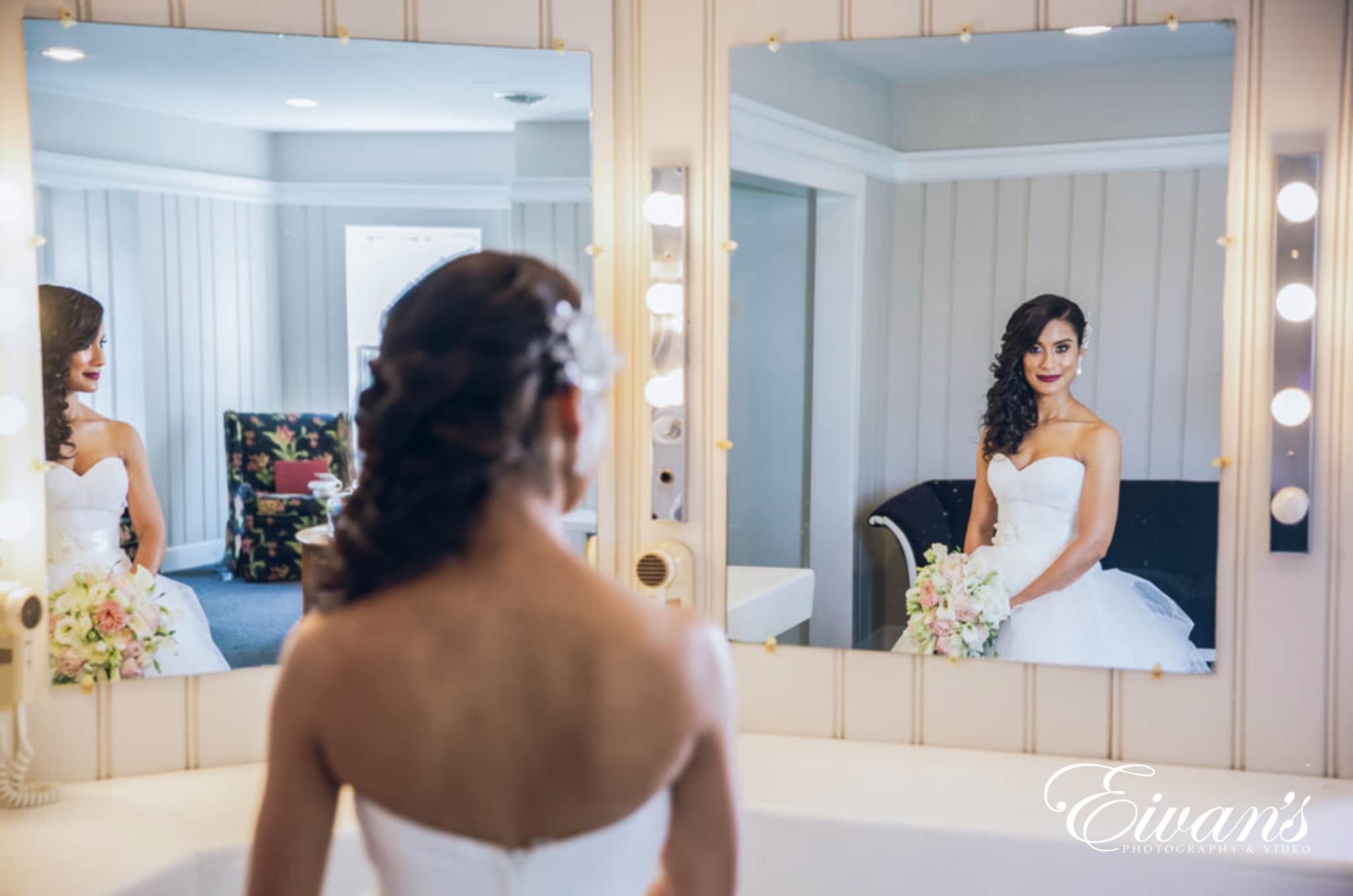 image of bride looking in the mirror at the bridal salon