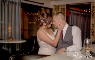 image of a married couple kissing at the casino bar