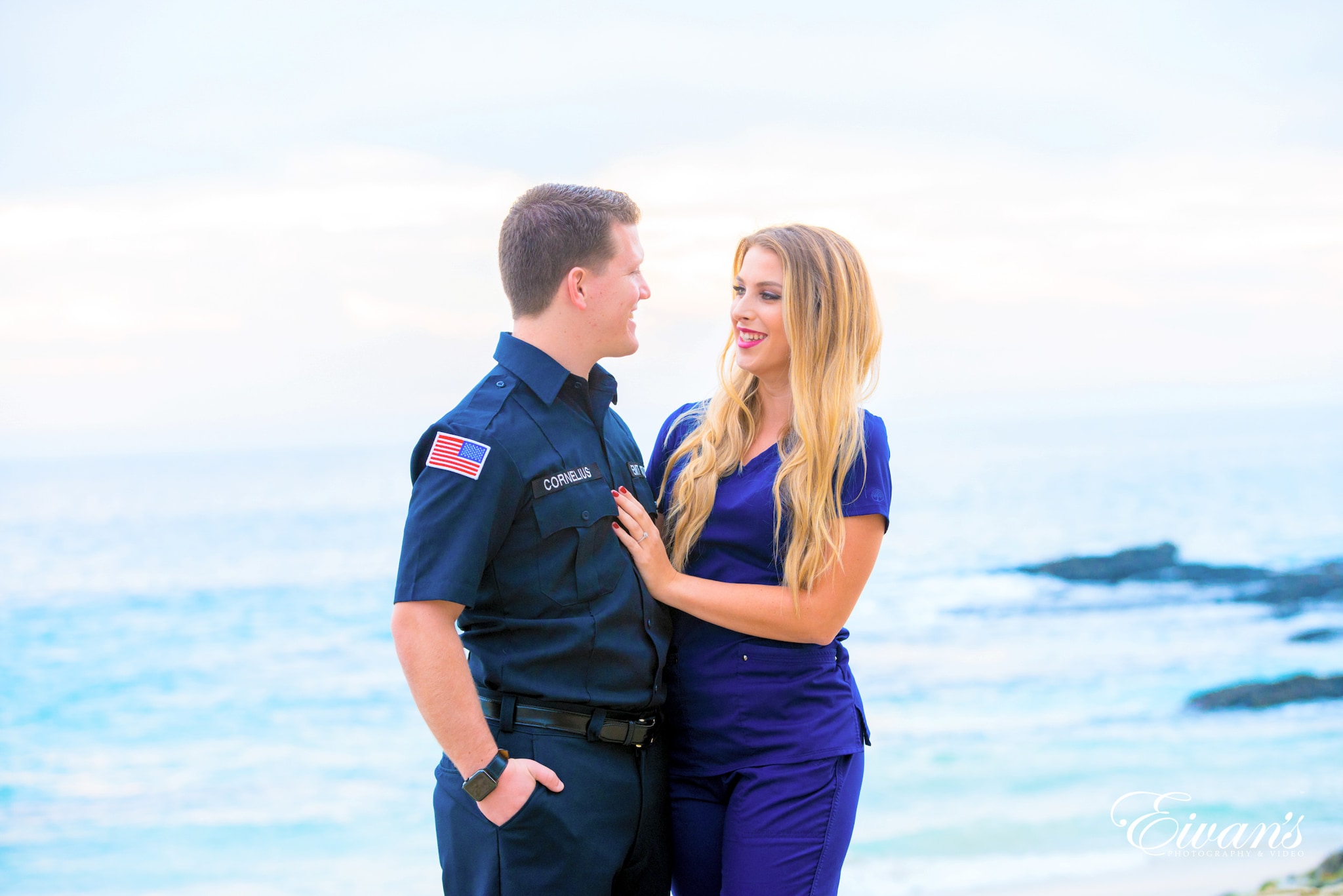 Beach Engagement Photos (155) man and woman standing beside each other near body of water during daytime