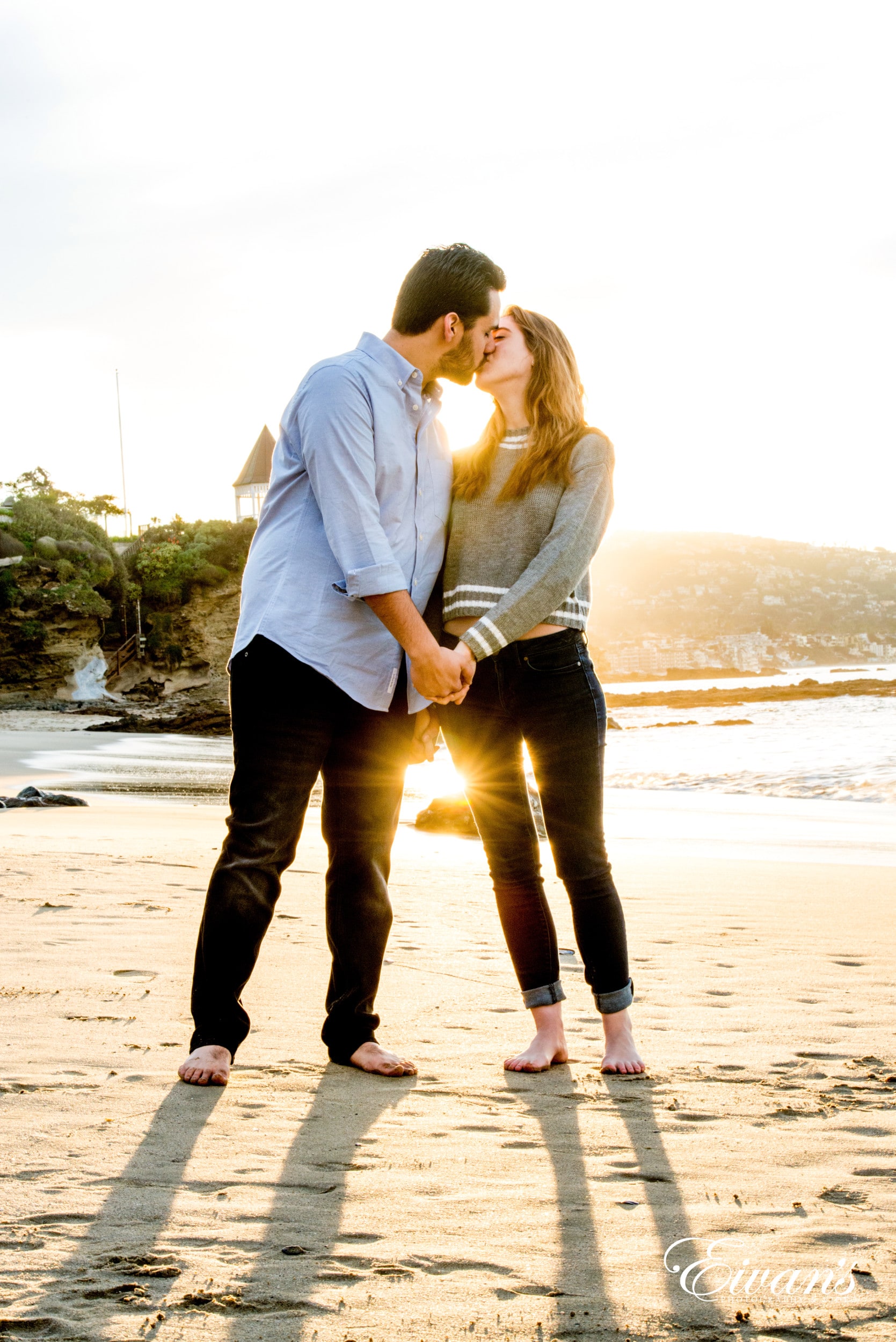 Beach Engagement Photos (236) man and woman kissing on beach during daytime