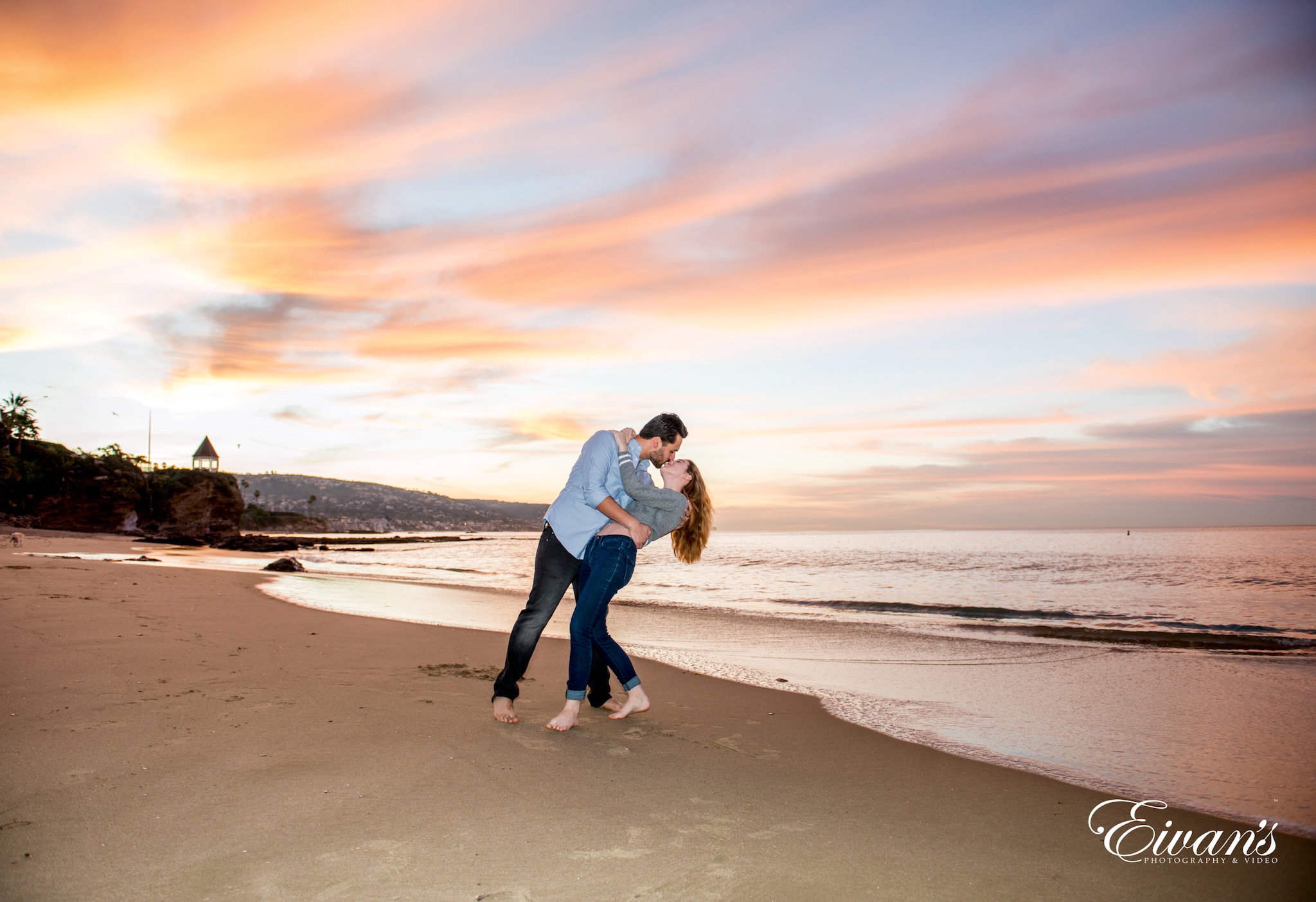 Beach Engagement Photos (73) man in white dress shirt and black pants running on beach during sunset