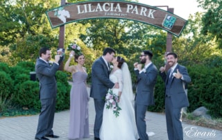 man in black suit jacket and woman in white wedding dress