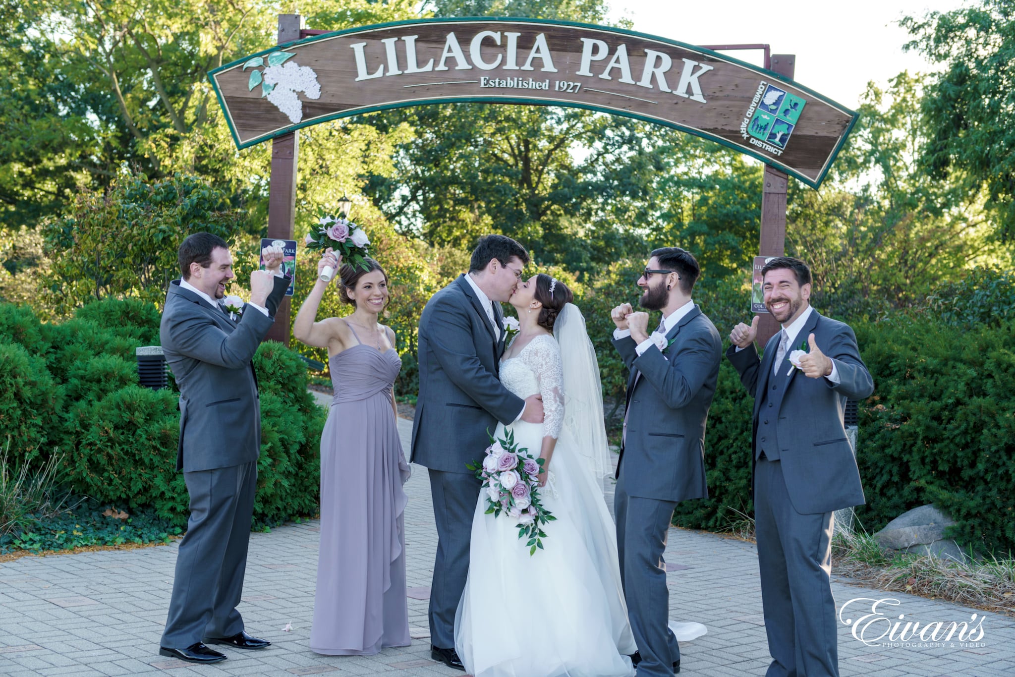 man in black suit jacket and woman in white wedding dress