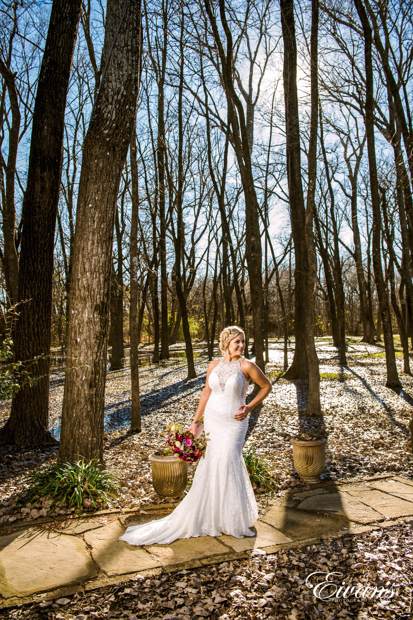 woman in white dress standing on forest during daytime