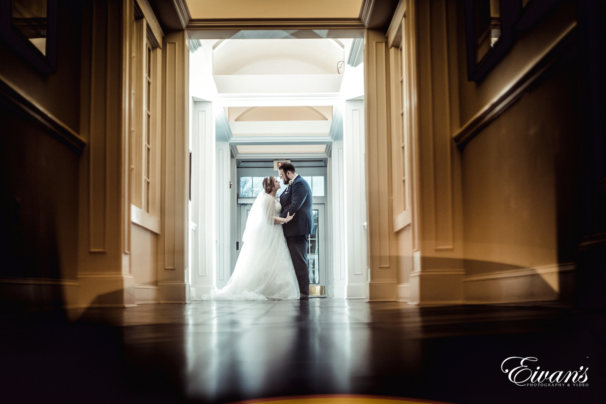 man and woman kissing inside building