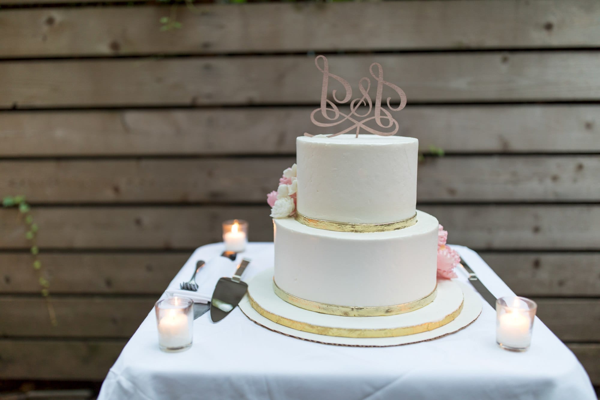 a white wedding cake sitting on top of a table