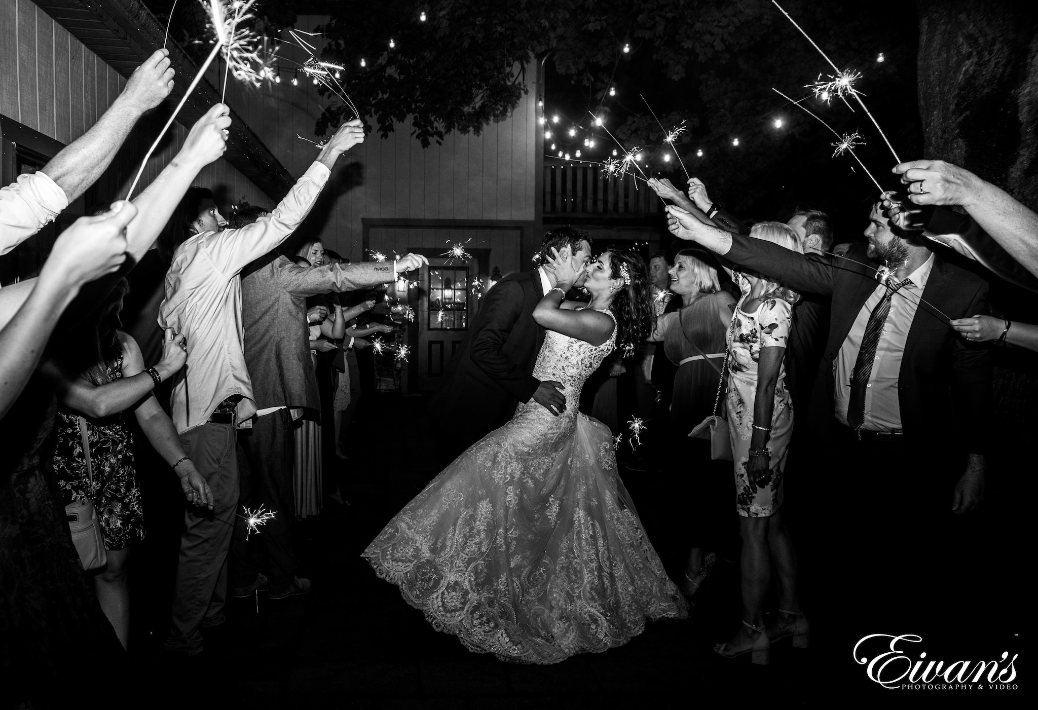grayscale photo of bride and groom dancing
