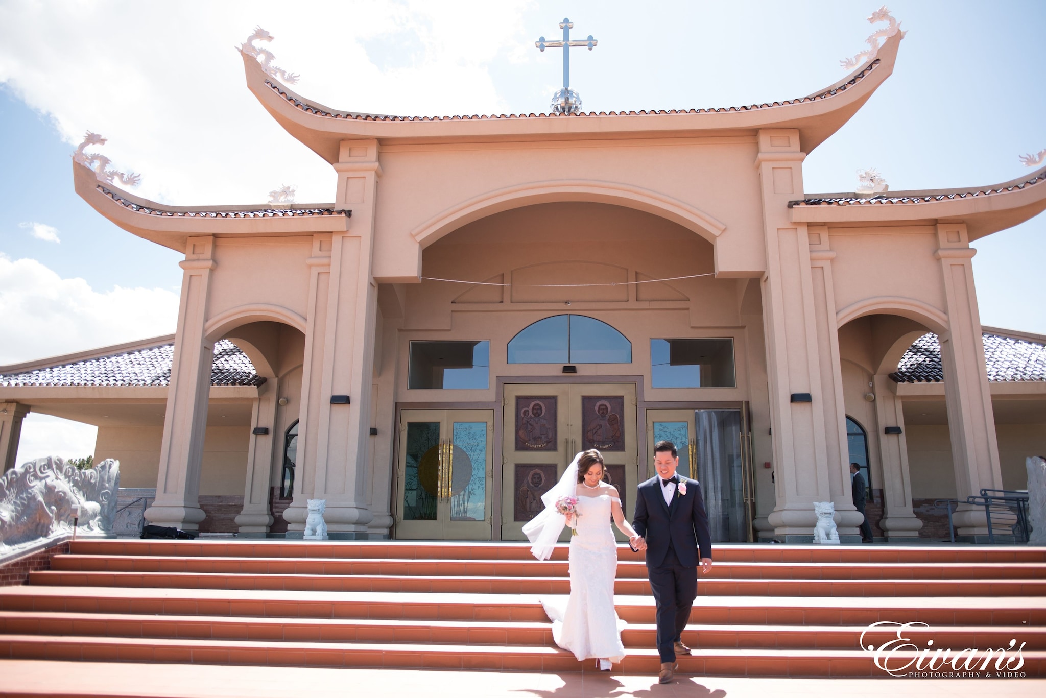 man and woman standing in front of brown concrete building during daytime