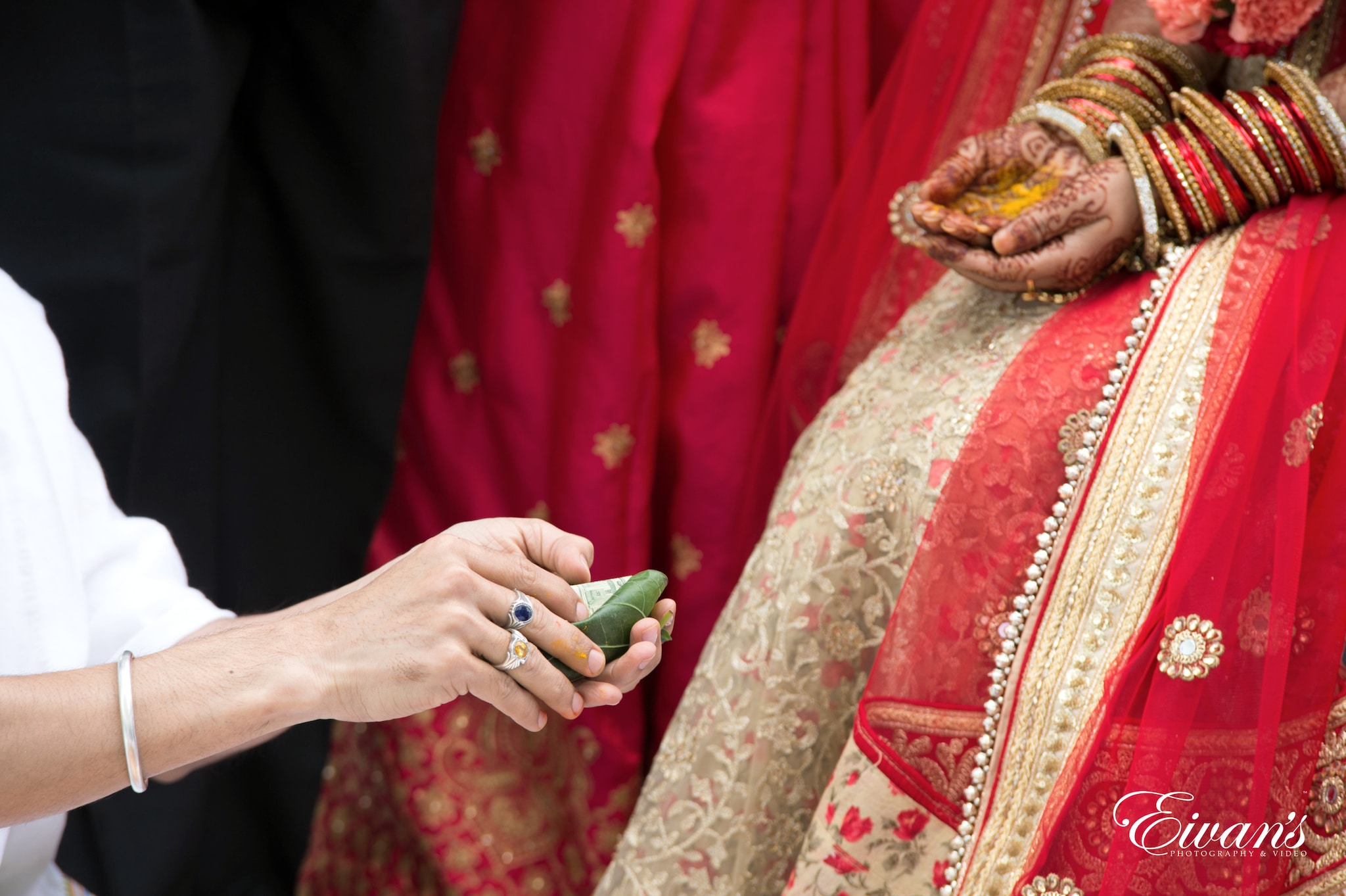 woman in red and white floral long sleeve dress holding green textile