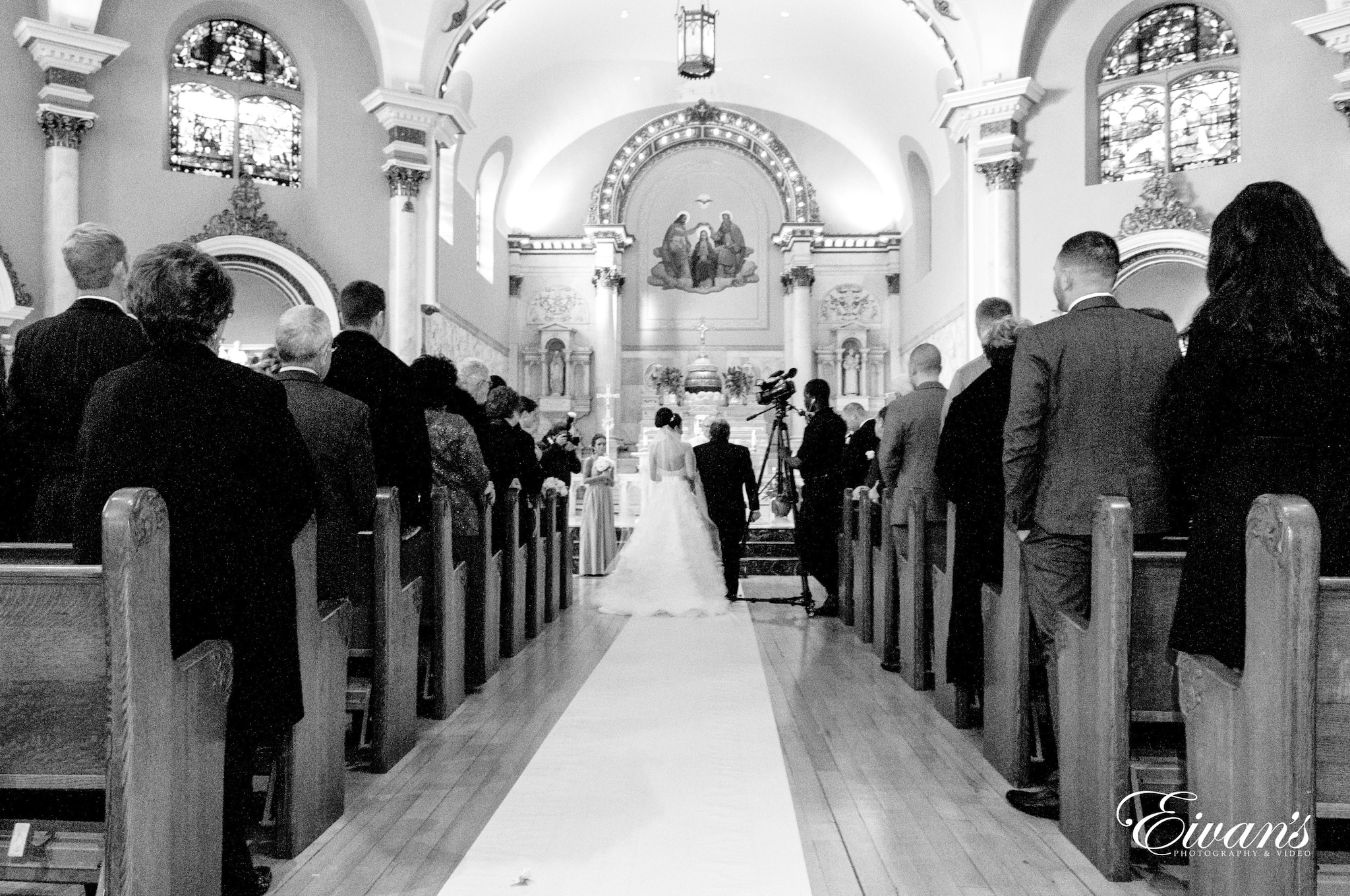 people in black suit standing in church