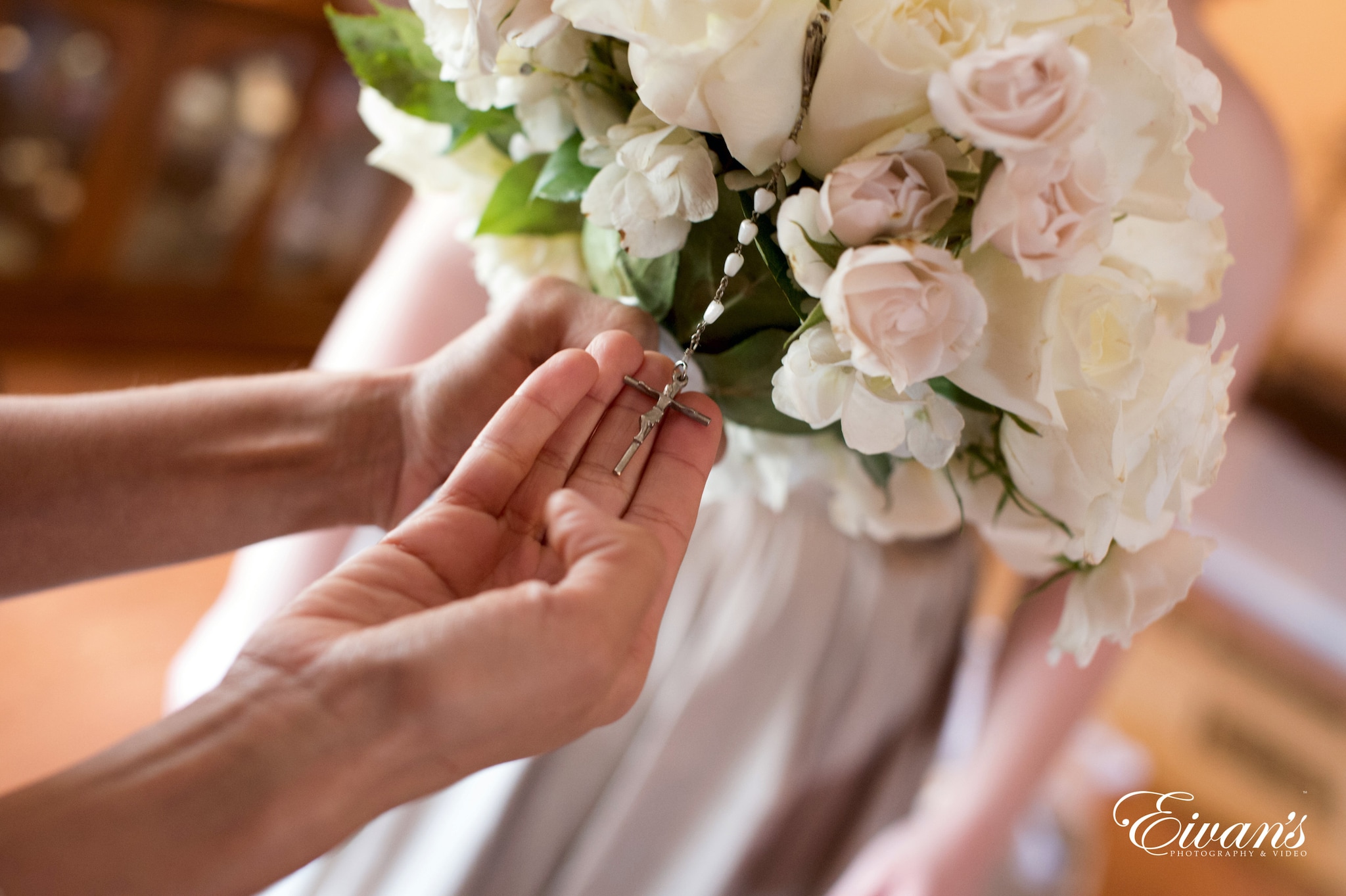 person holding white rose bouquet
