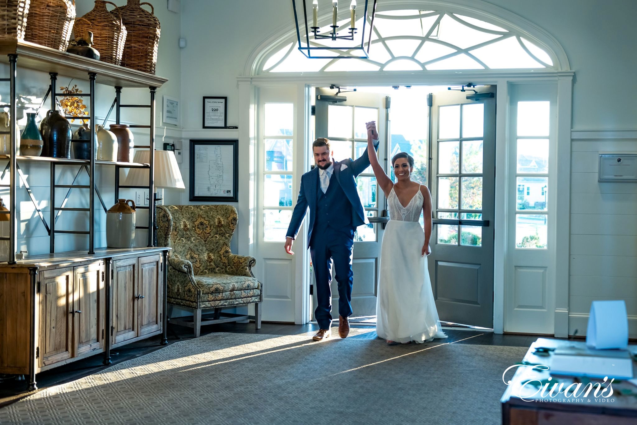 man in black suit standing beside woman in white wedding dress
