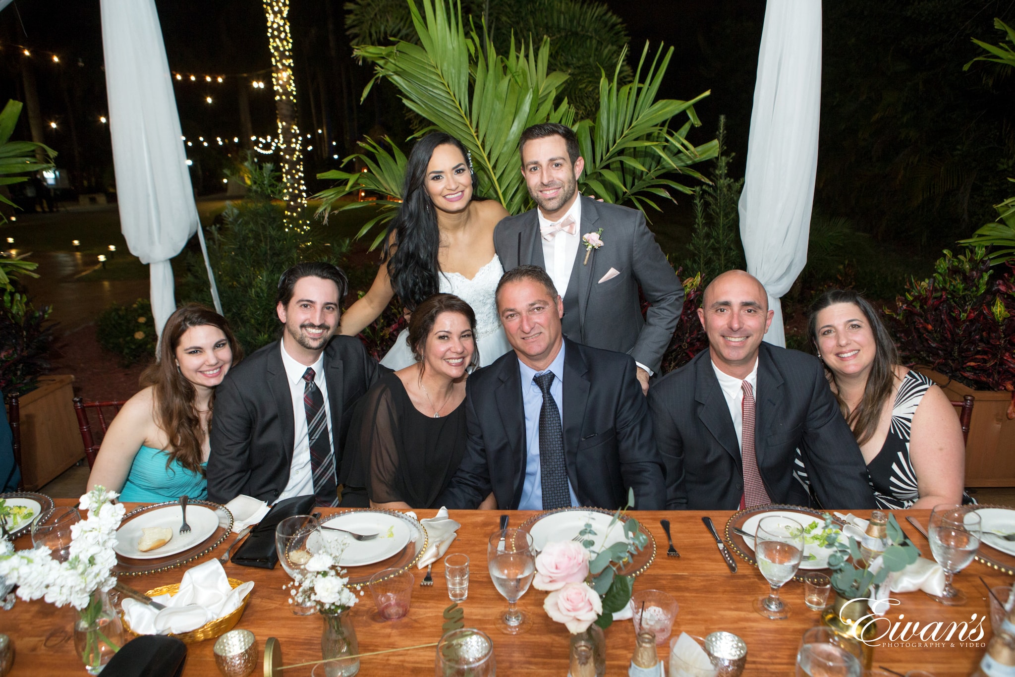 group of people sitting on chair in front of table