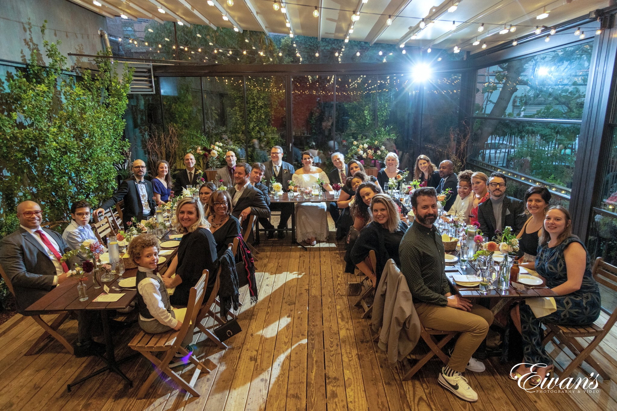people sitting on brown wooden chairs