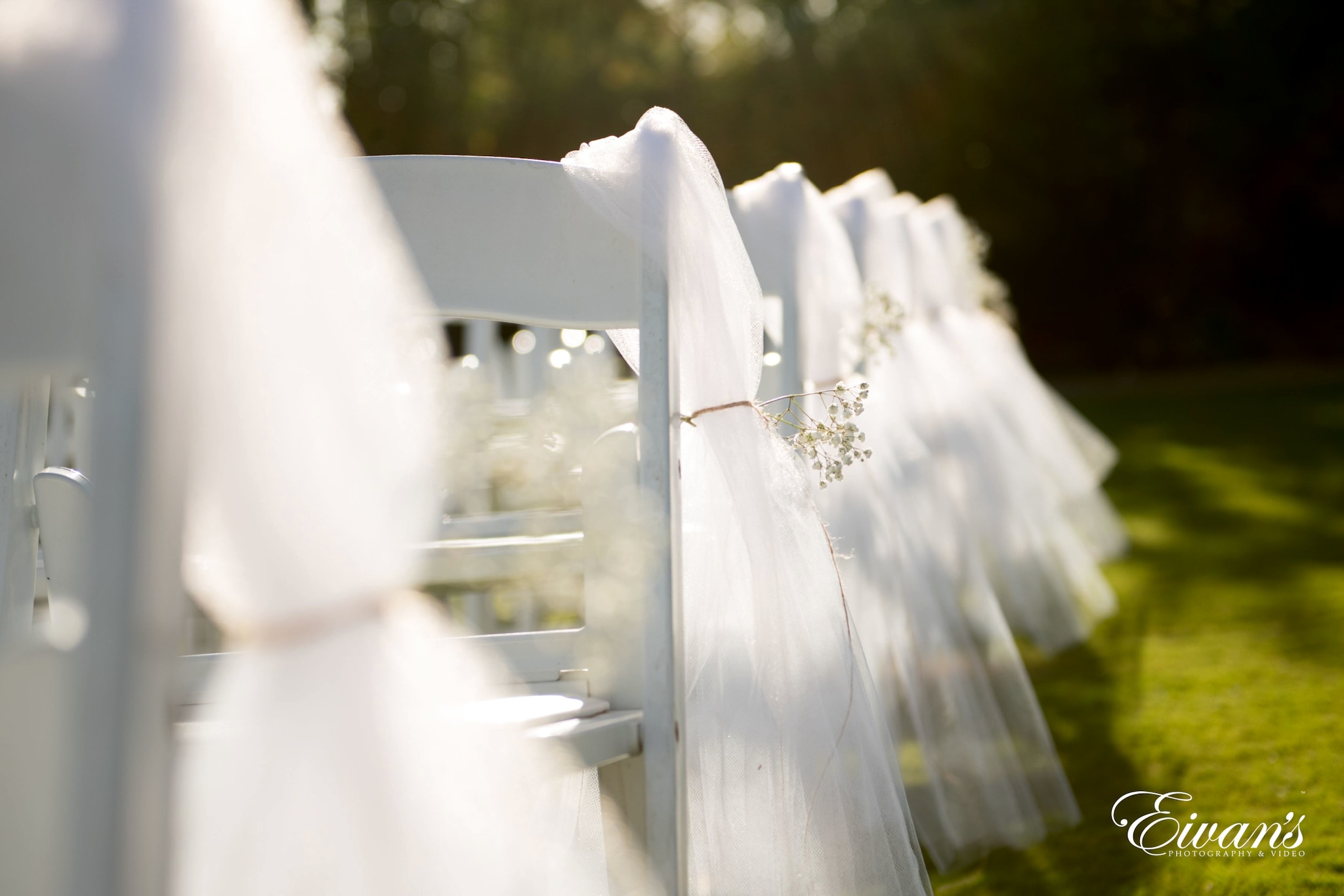 white textile on gray metal fence
