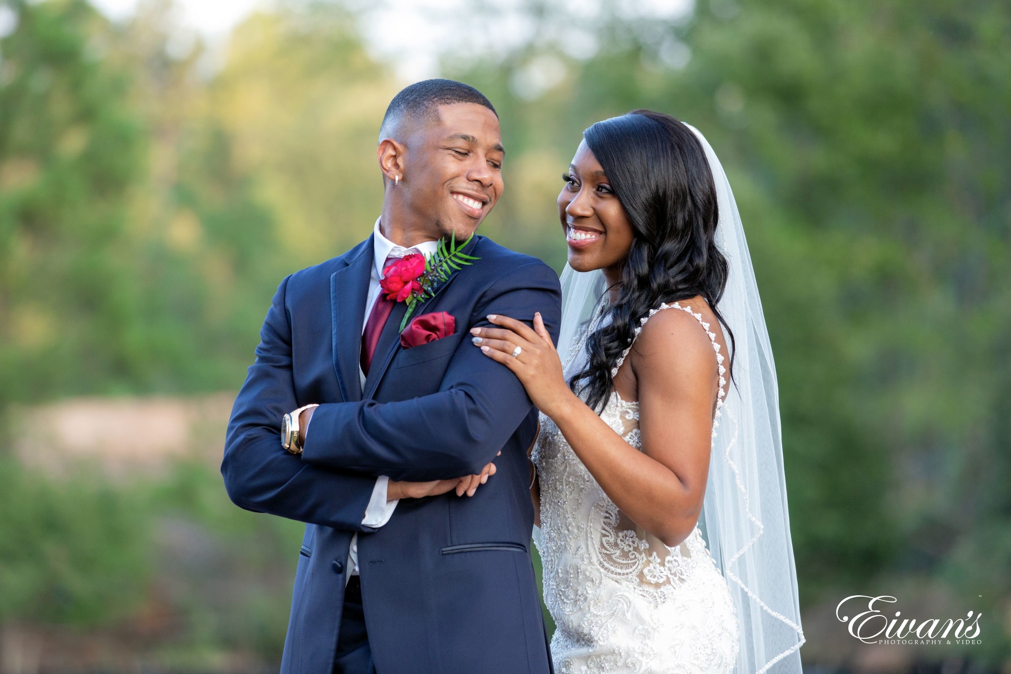 bride and groom posed outside in the daytime